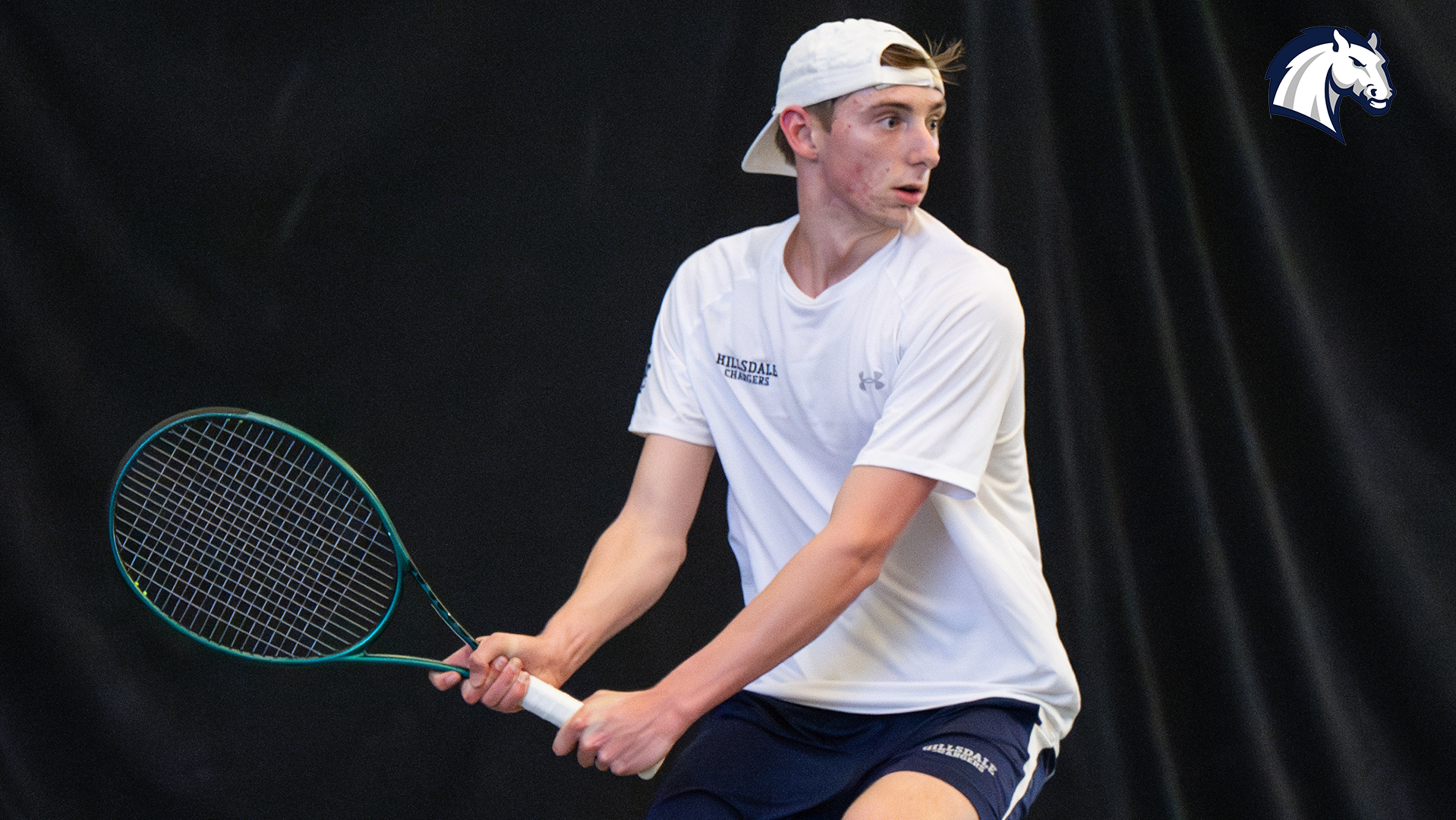 Hillsdale's Sam Plys lines up a return shot during a match against Northwood in April of 2025.