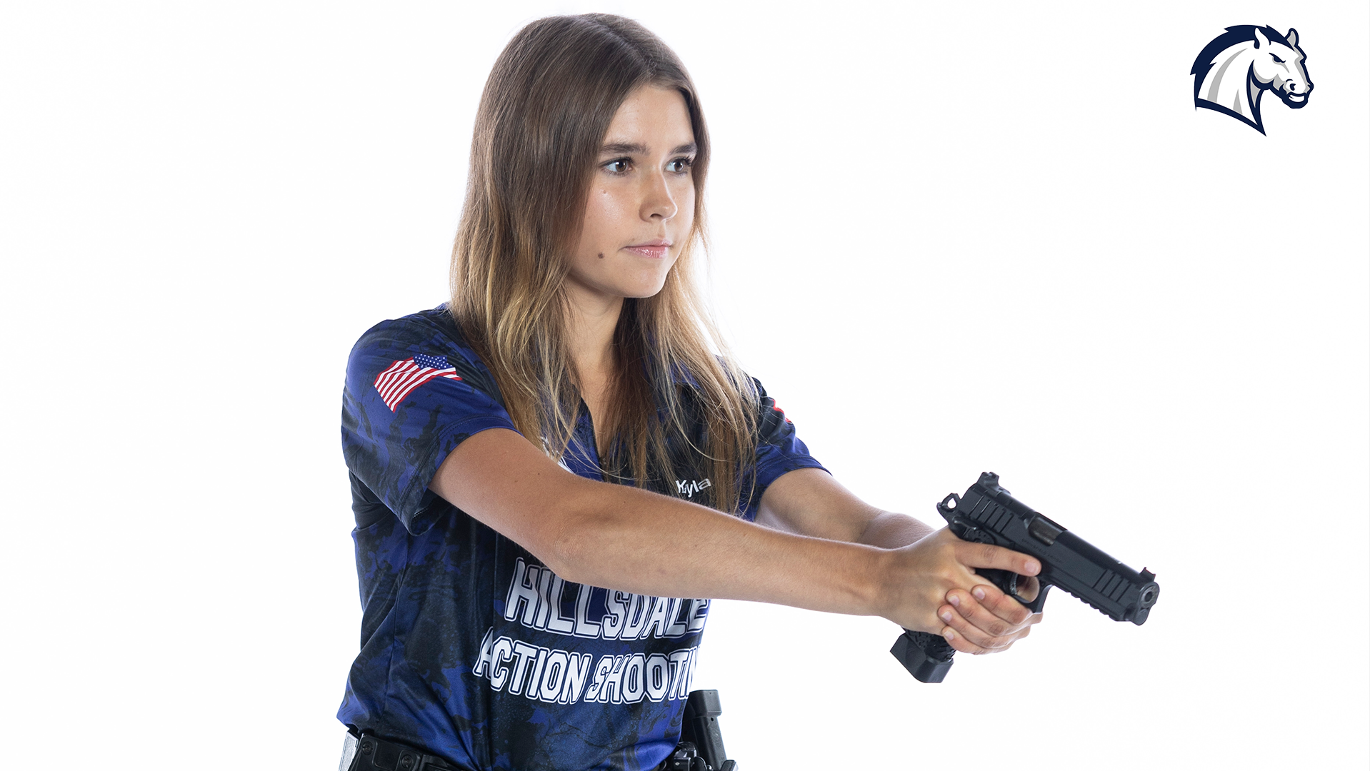 Kayla Mullin poses for a photo at the 2024 media day for the Action Shooting team.