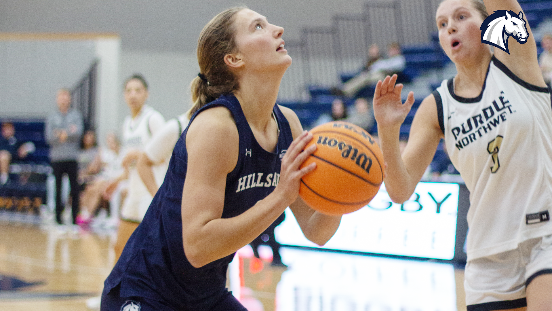 Grace McKinney lines up a shot for the Chargers in Hillsdale's game against Purdue Northwest on Nov. 15, 2025.