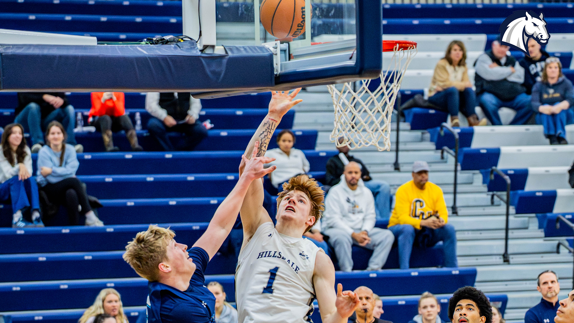 Hillsdale's Caleb Glaser lays in a basket against Cedarville on January 15, 2026.