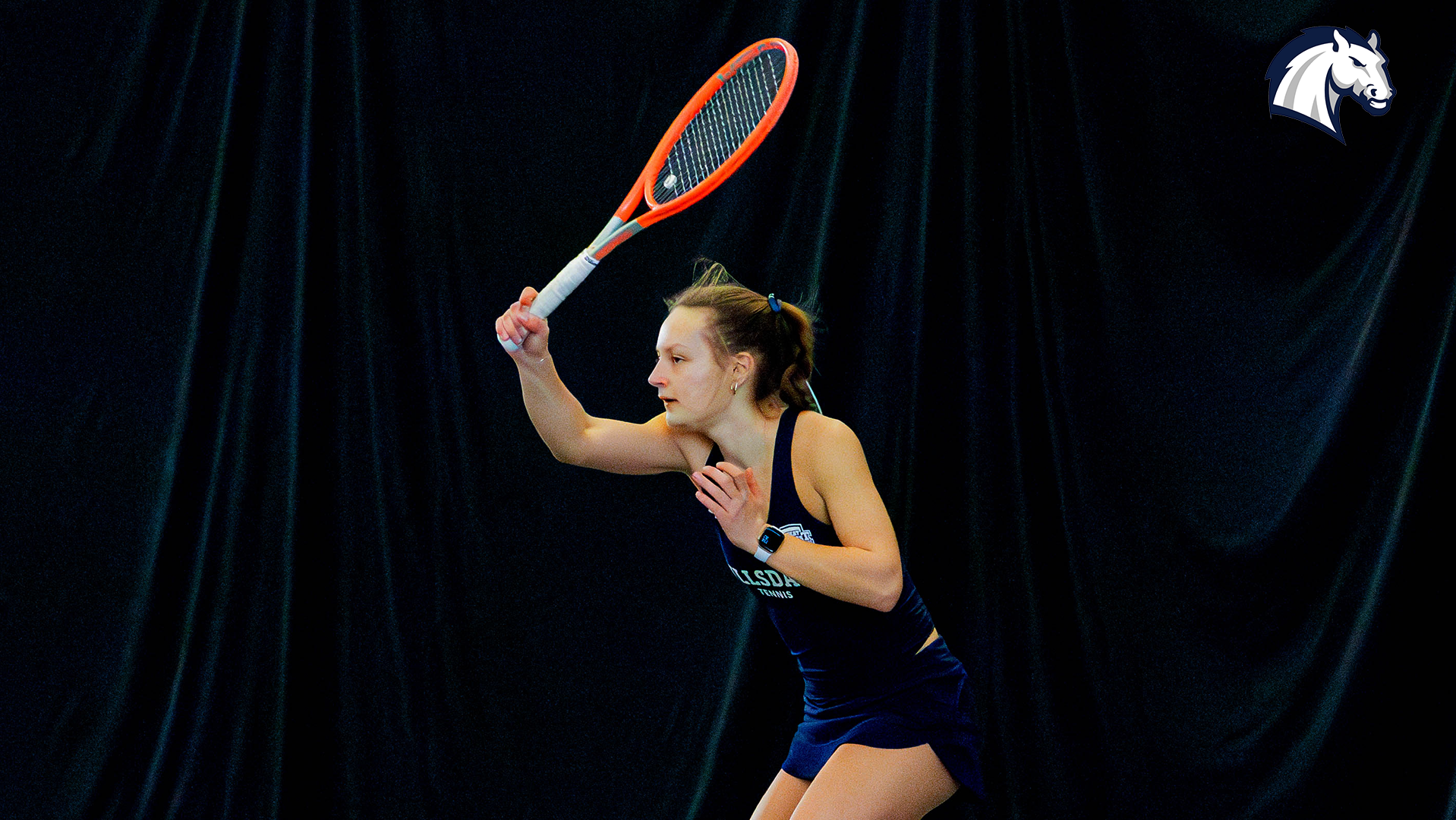 Hillsdale's Esther Sura returns a serve during a January 30, 2026 match against Spring Arbor.