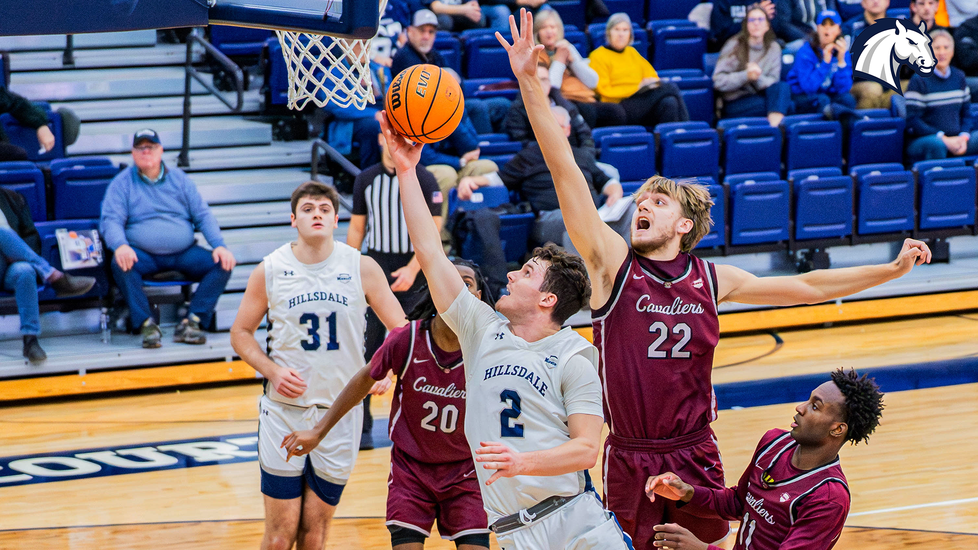 Hillsdale's Ashton Janowski (2) glides through the Walsh defense for a layup on Jan. 5, 2026.