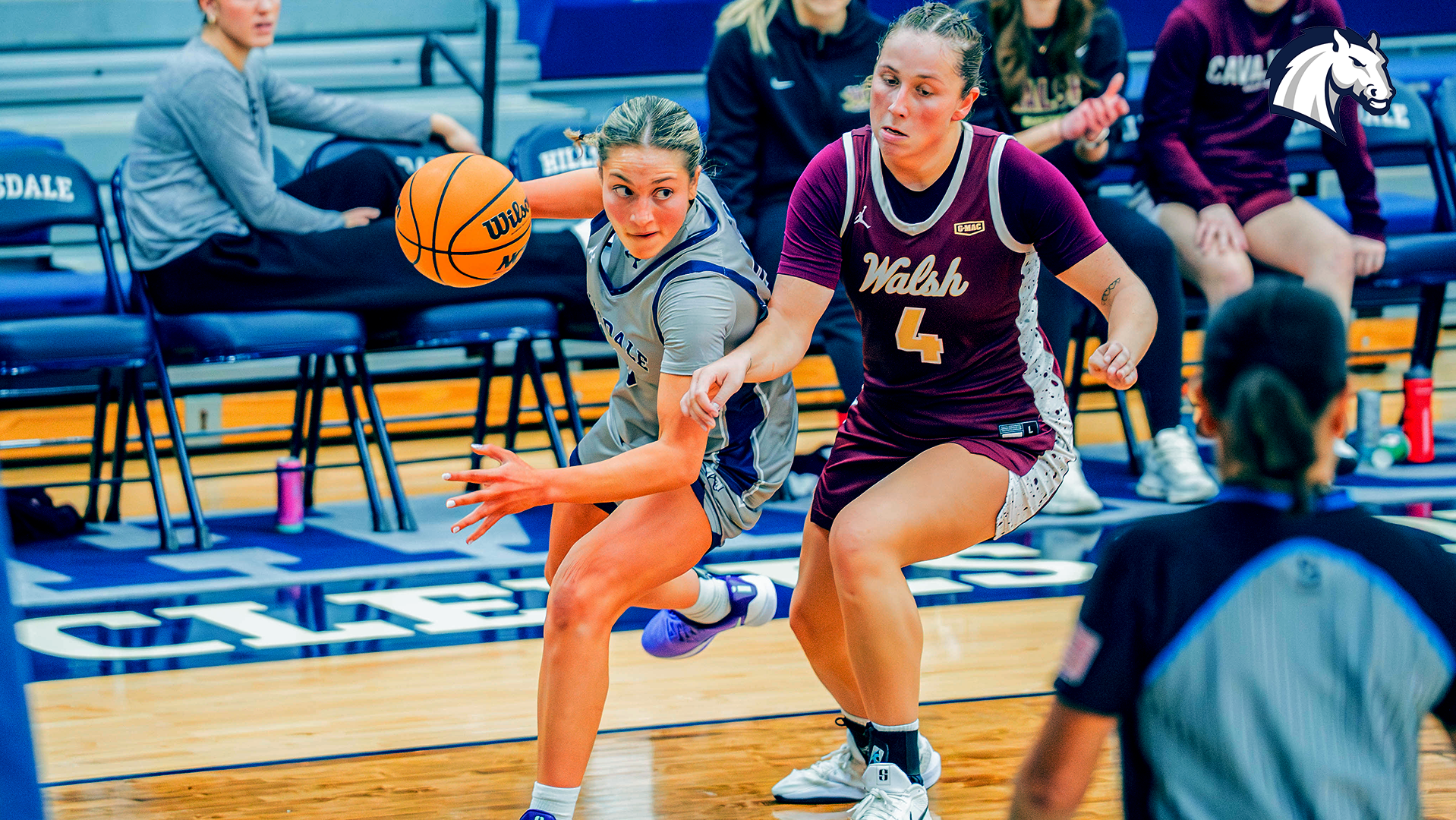 Hillsdale's Annalise Pietrzyk (left) looks to get by a Walsh defender on a drive to the basket on Jan. 5, 2026.