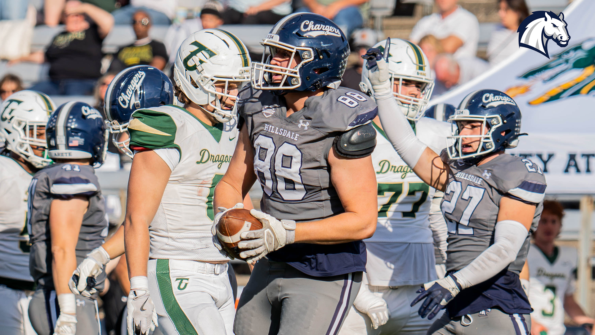 Hillsdale's Evan Bienick holds the ball after stopping a Tiffin player on third down during an Oct. 24, 2026 game.