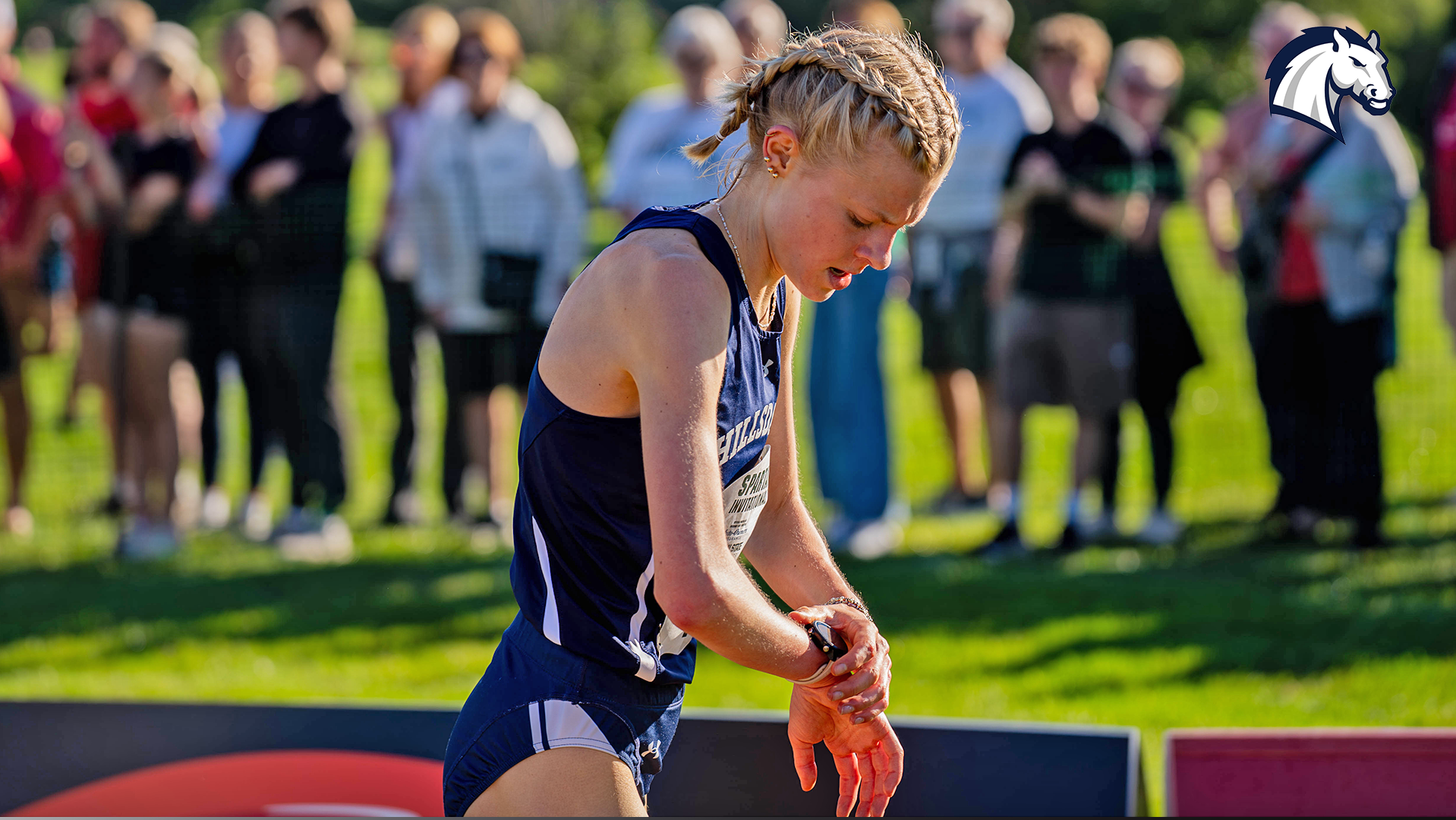Allison Kuzma checks her watch after finishing the 2026 MSU Spartan Invitational.