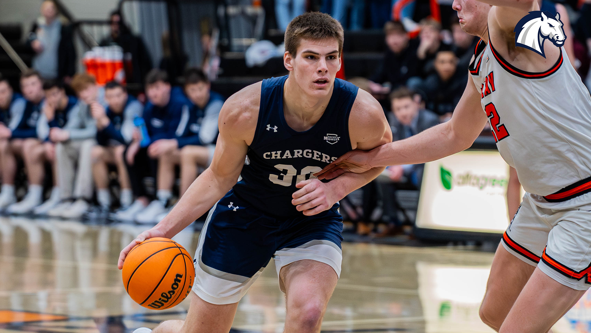 Connor Stonebraker tries to drive by a Findlay defender during a game on Jan. 22, 2026.