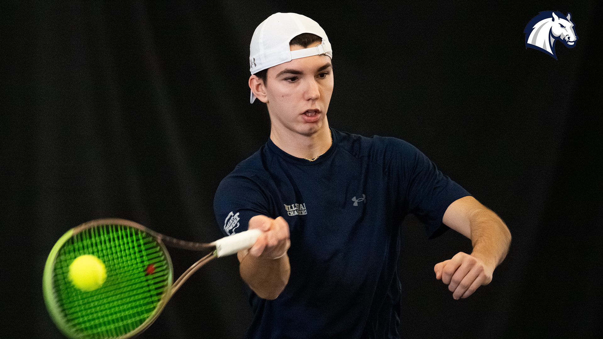 Hillsdale's Patrick Cretu hits a return shot during a match against Goshen on Feb. 7, 2026.