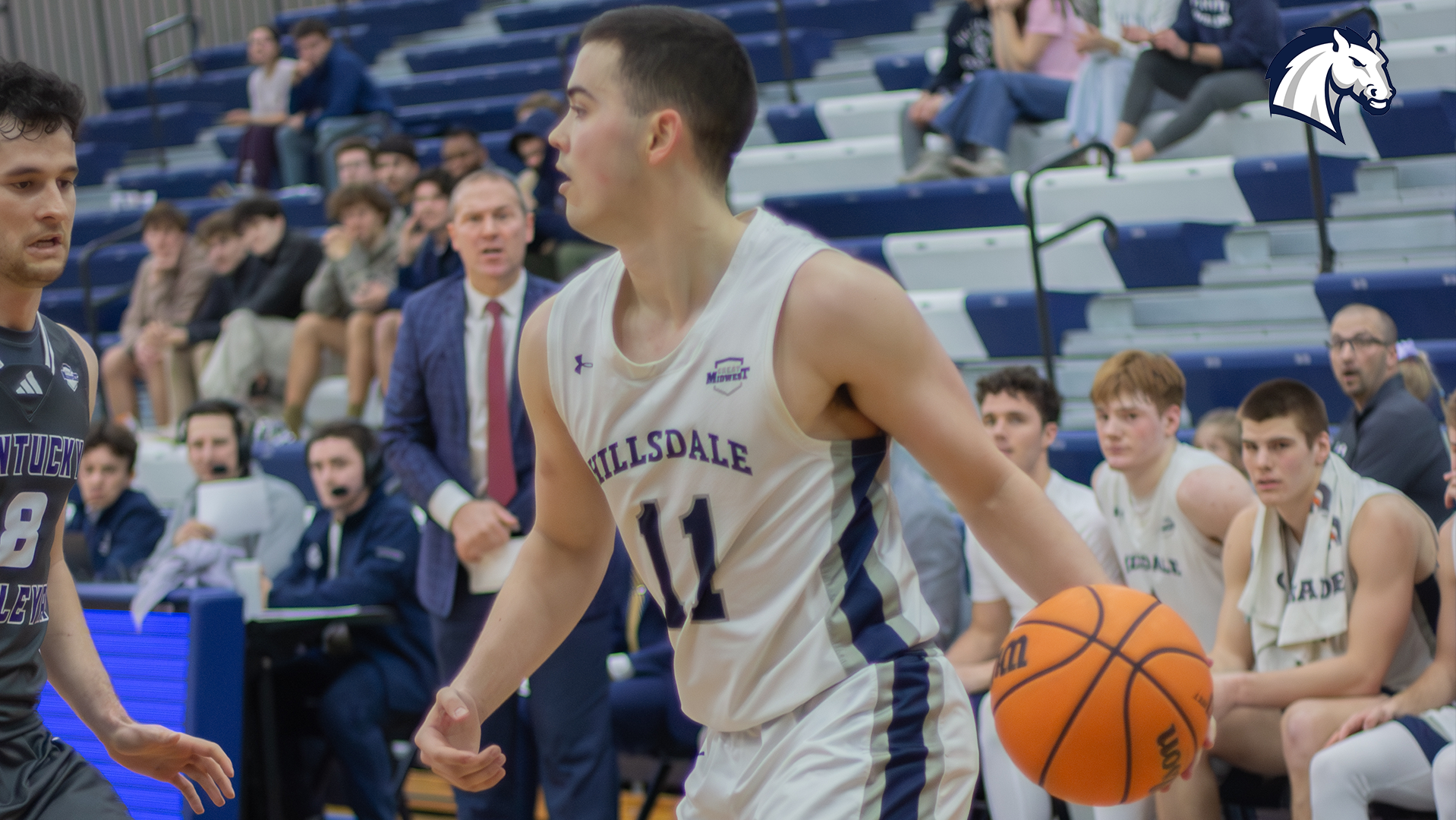 Hillsdale's Cole McWhinnie dribbles and surveys the floor during a game against Kentucky Wesleyan on Feb. 19, 2026.