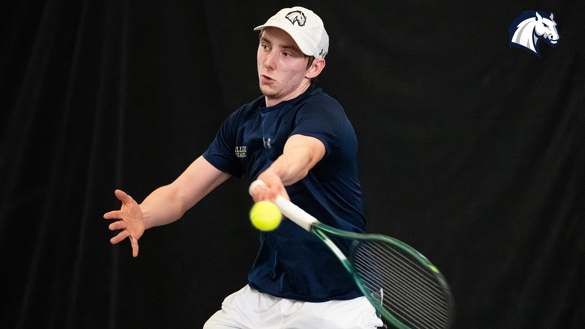 Hillsdale's Sam Plys hits a return shot during a match against Goshen on Feb. 7, 2026.
