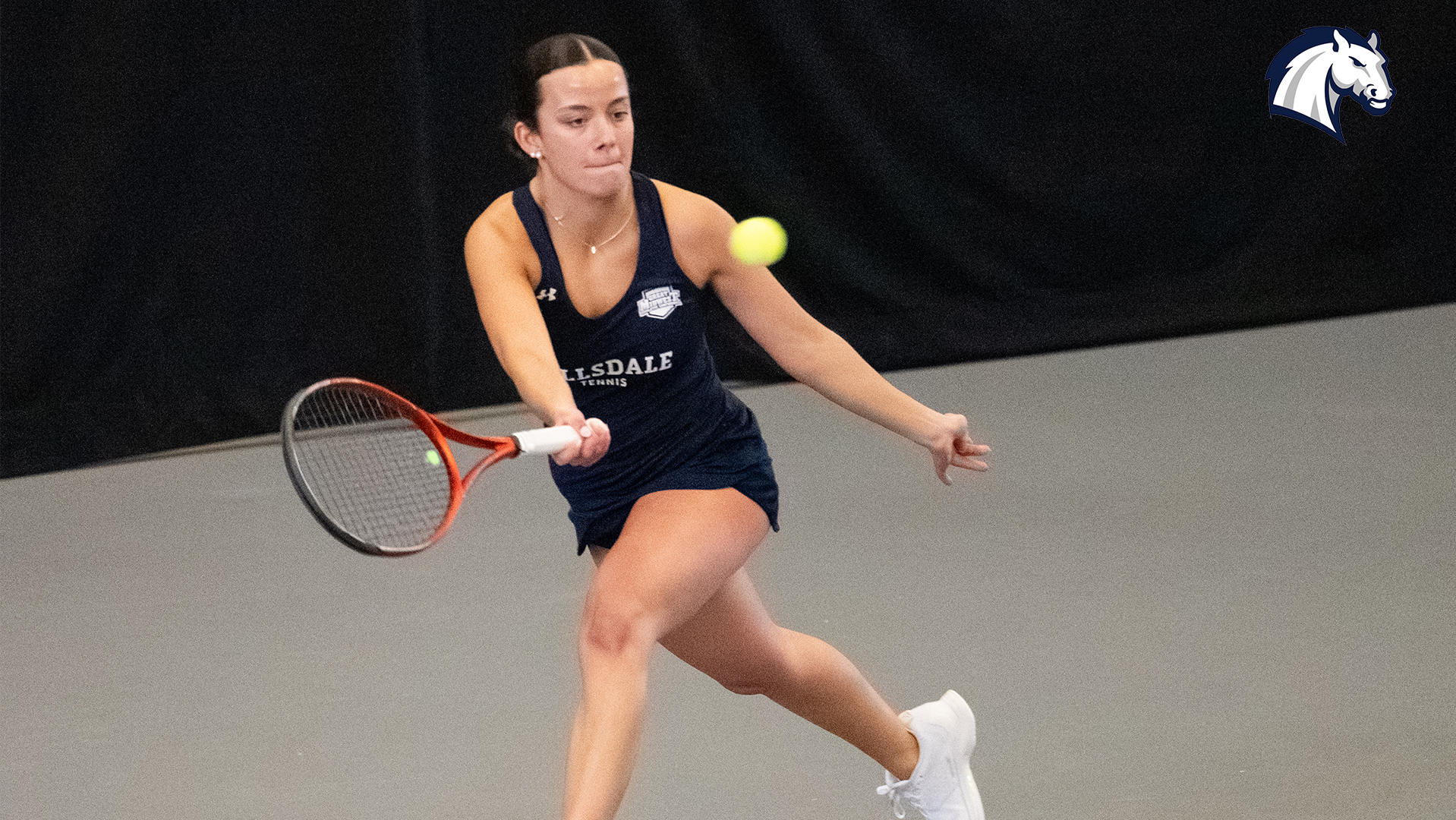 Hillsdale's Isabella Spinazze lines up a return shot during a match against Goshen on Feb. 7, 2026.