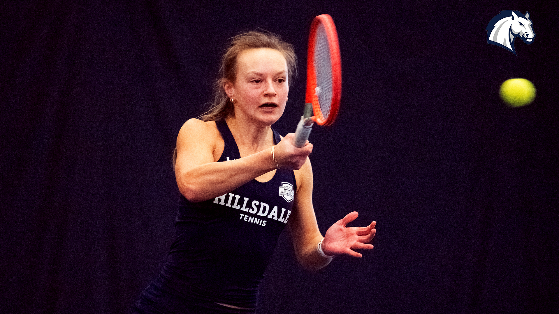 Hillsdale's Esther Sura hits a return shot during a match against Goshen on Feb. 7, 2026.
