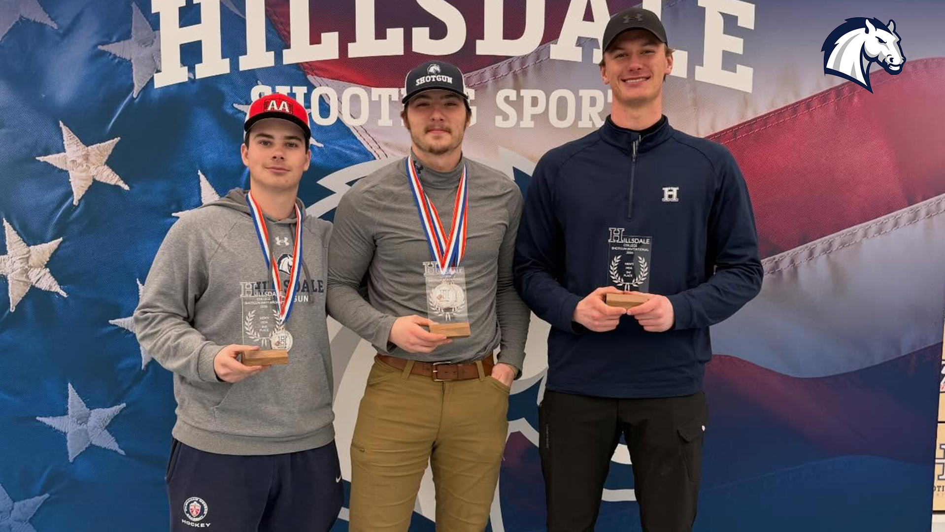 Hillsdale College shotgun winners (from left) Roman Barrett, Luke Johnson and Davis Hay pose with awards after the 2026 Hillsdale Invitational.