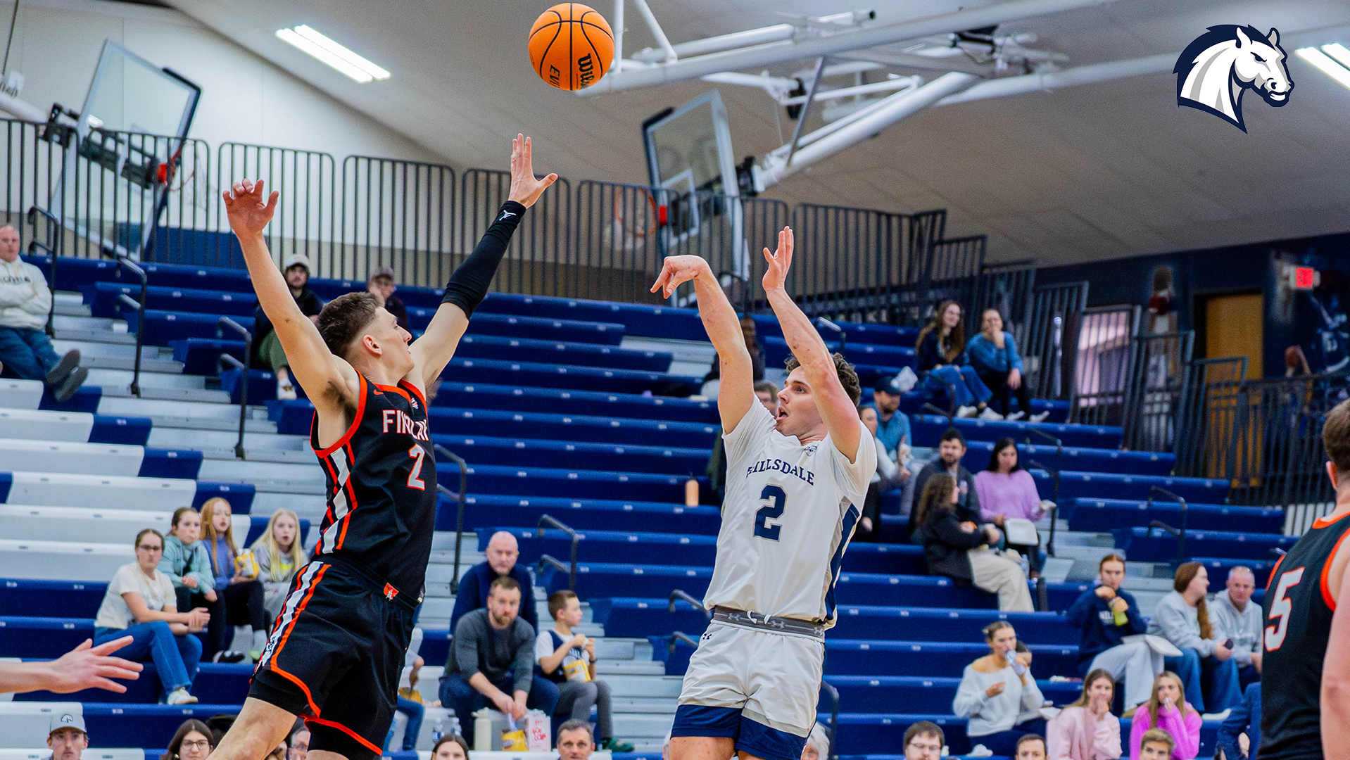 Hillsdale senior Ashton Janowski shoots over a Findlay defender during a home contest on Feb. 26, 2026.