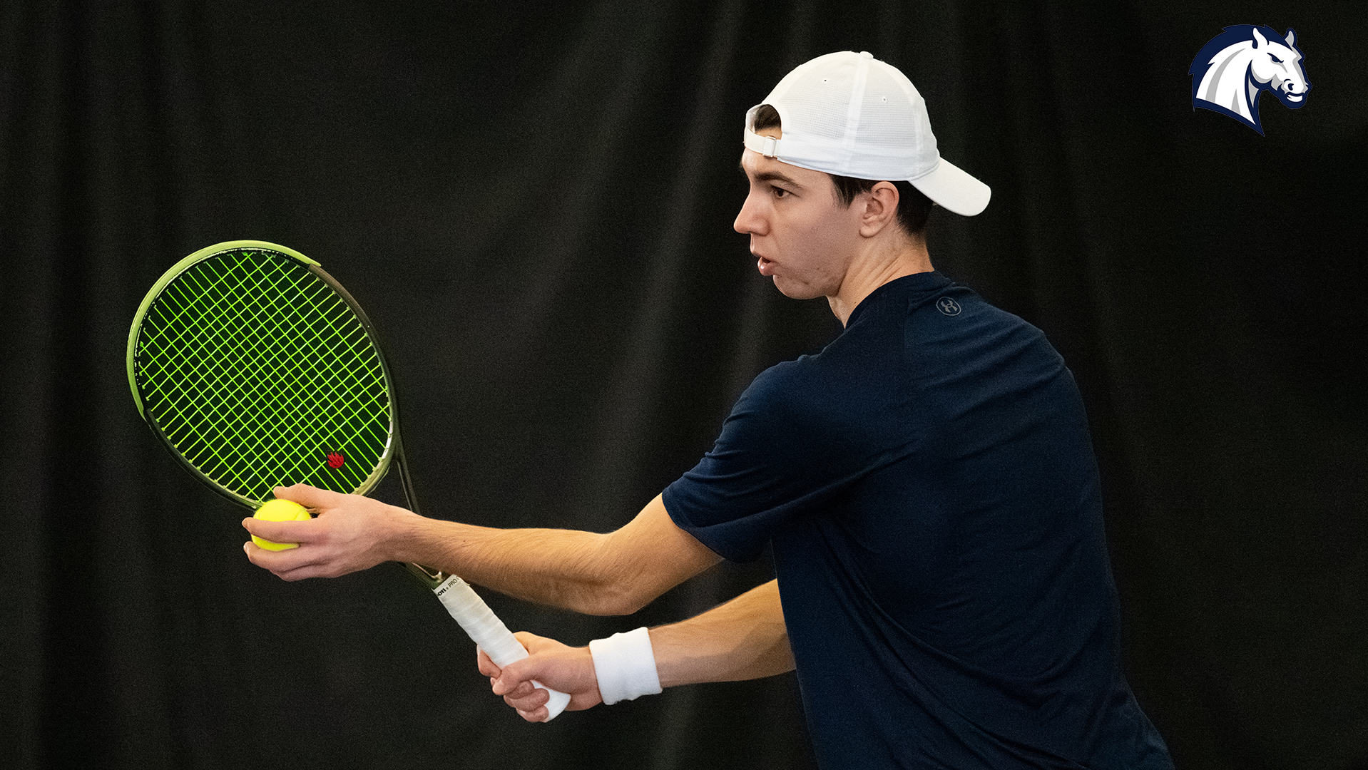Hillsdale's Patrick Cretu prepares to serve during a match against Goshen on Feb. 7, 2026.