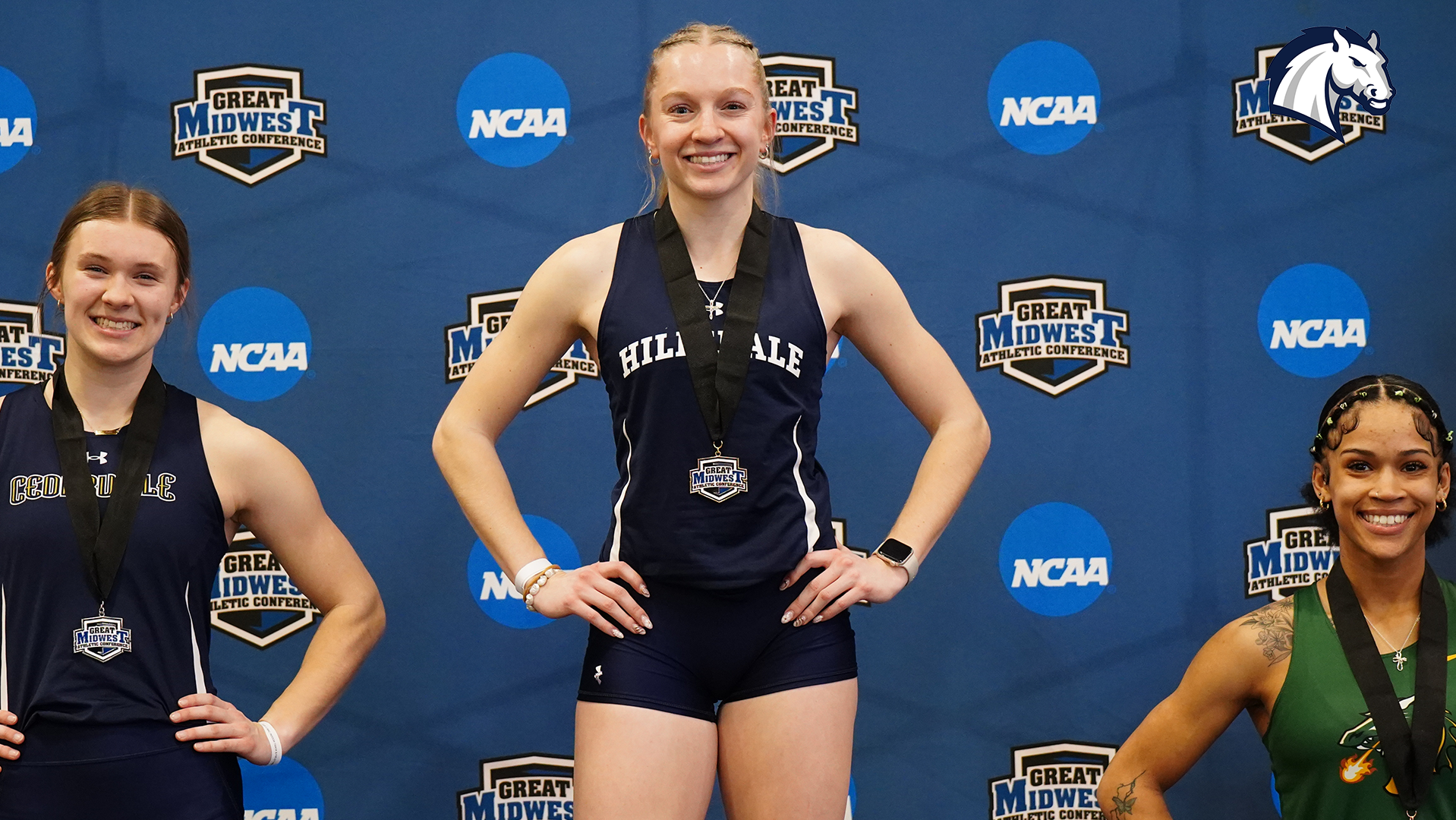 Hillsdale's Anna Roessner poses with her medal won after taking first in the 60m dash at the 2026 G-MAC Indoor Championships.