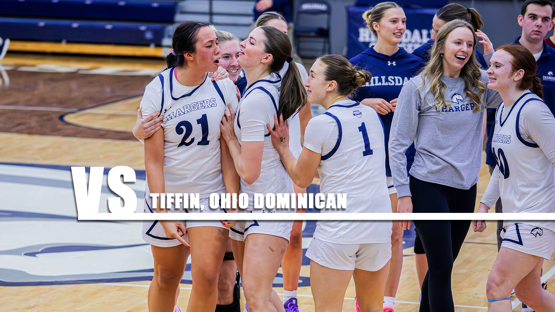 Hillsdale players mob Savannah Smith (21) after a Jan. 24, 2026 home win over Ashland.