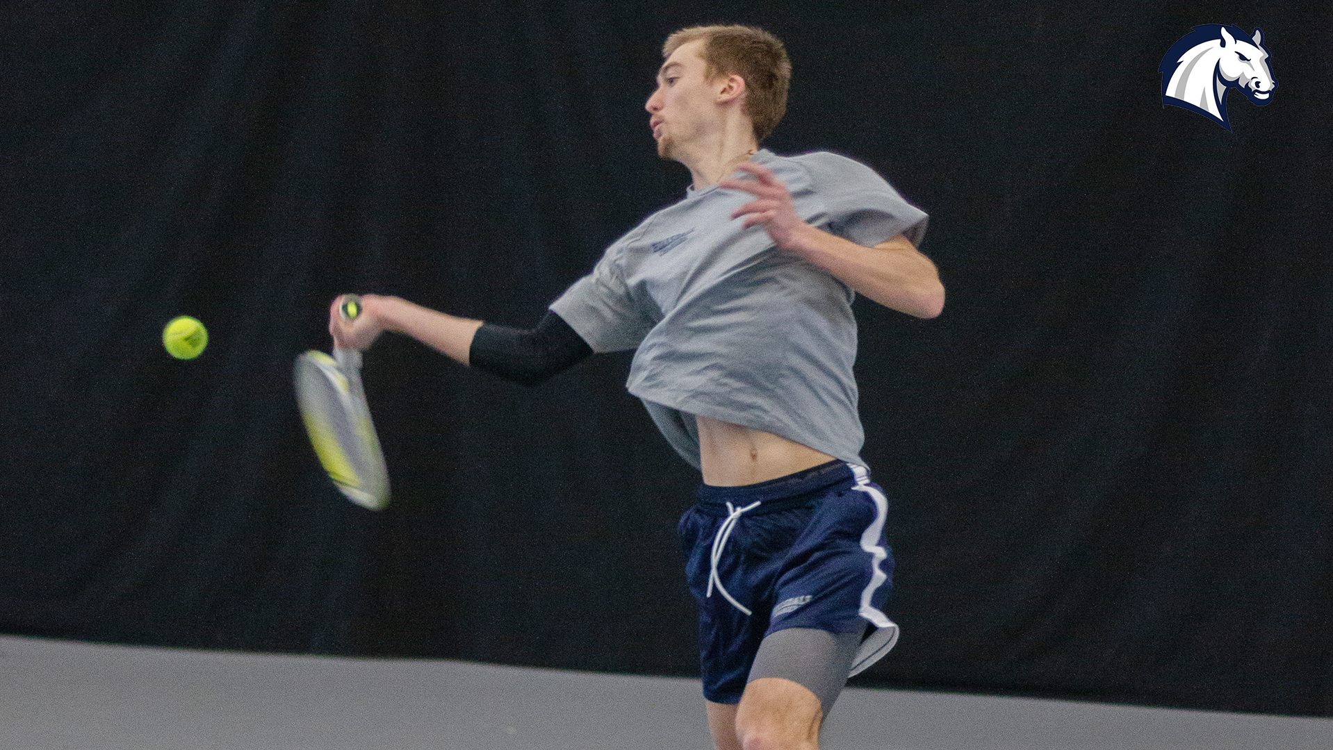 Hillsdale's Henry Hammond hits a forehand return against Michigan Tech on Jan. 31, 2026.