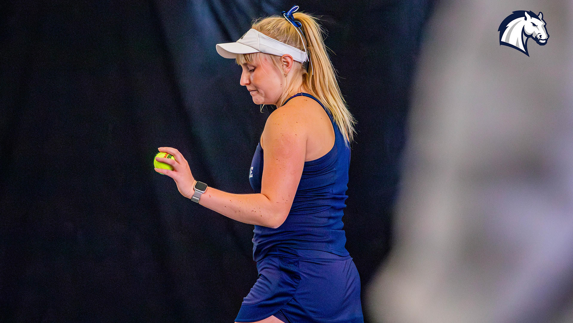 Hillsdale's Ane Dannhauser prepares to serve during a match against Spring Arbor on Jan. 30, 2026.