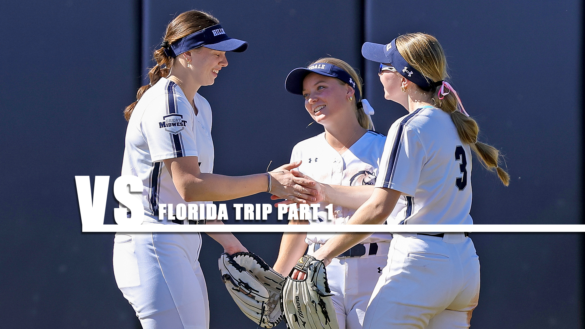 Hillsdale outfielders Maggie Olaveson, Emma Sather and Nathalie Hagle get fired up before the start of an inning on Feb. 7, 2026.