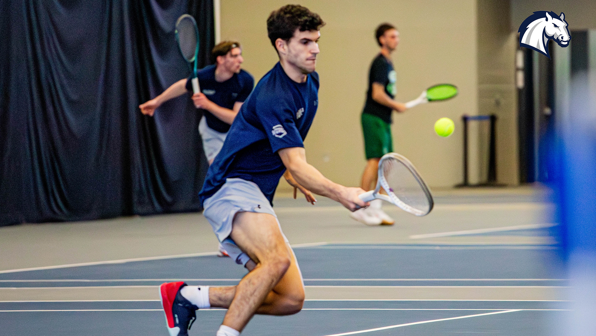 Hillsdale's Alex Cordero Lopez hits a return shot at the net during a match against Roosevelt on March 8, 2026.