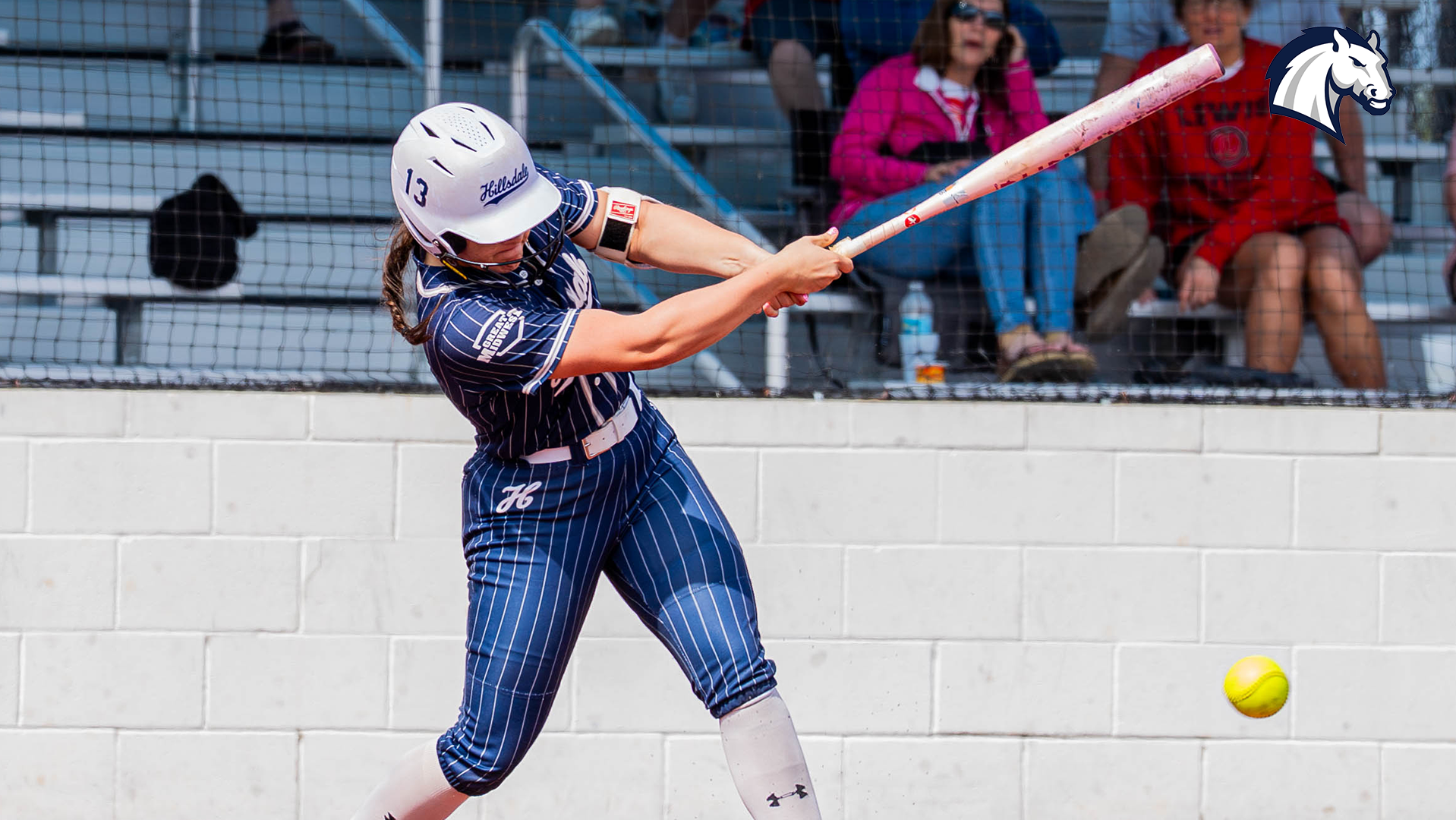 A Hillsdale softball player puts the ball in play during a game in Florida against Louis on March 15, 2026.