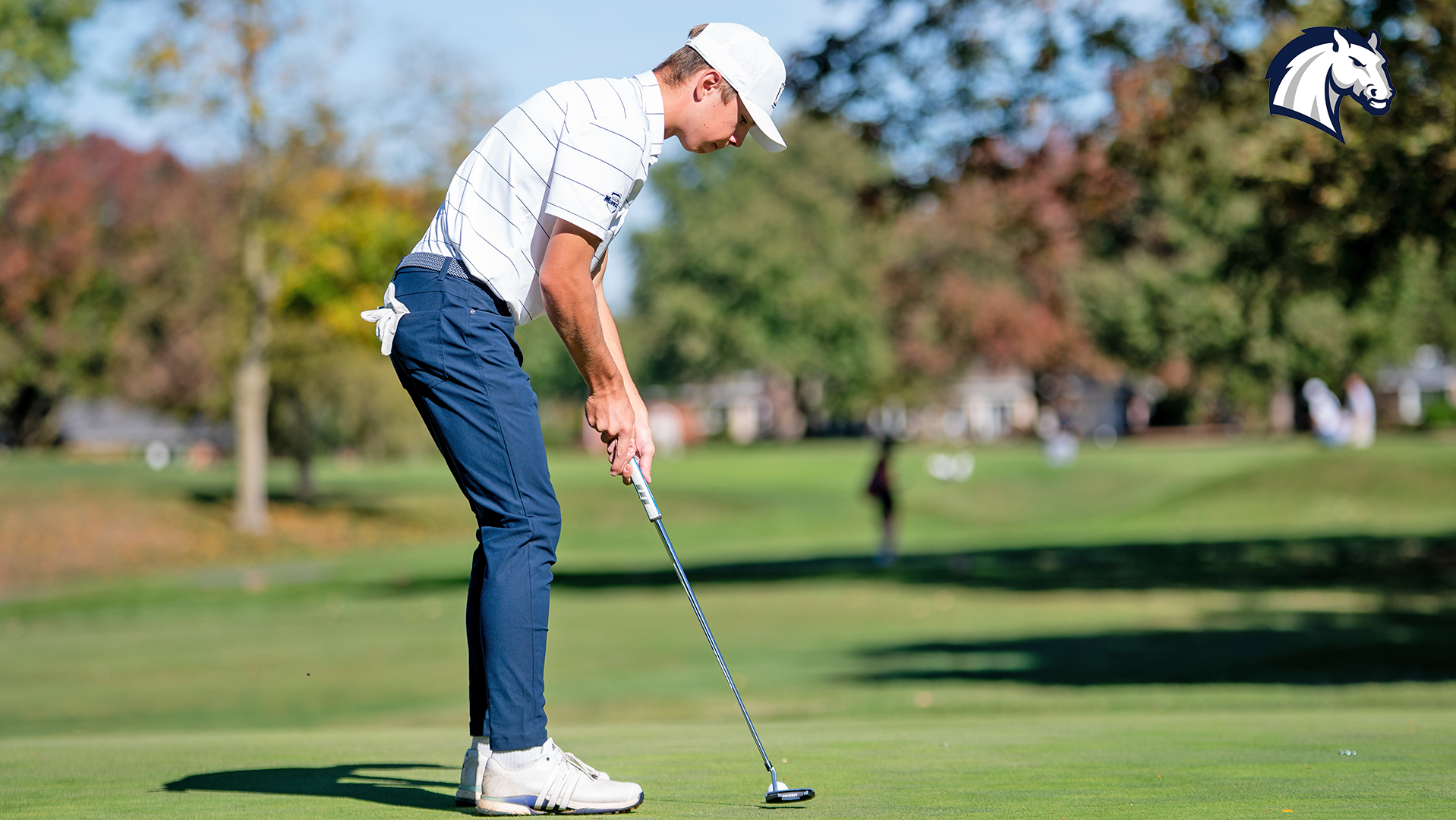 Hillsdale's Jackson Piacsek putts on the green during an invitational in the 2025-26 season.