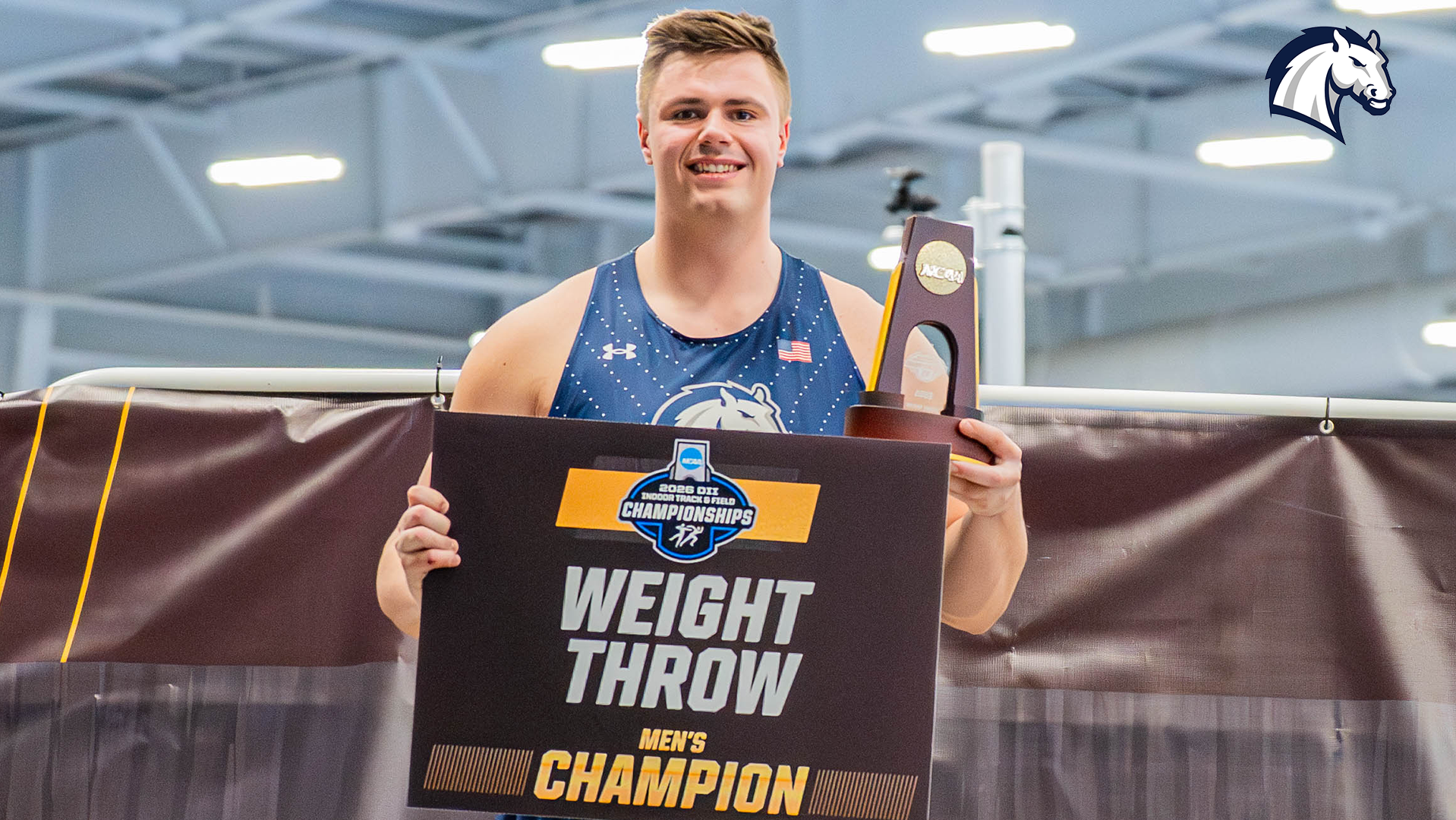 Hillsdale's Ben Haas poses with trophy and plaque after winning a repeat NCAA DII national title in the weight throw on March 13, 2026.