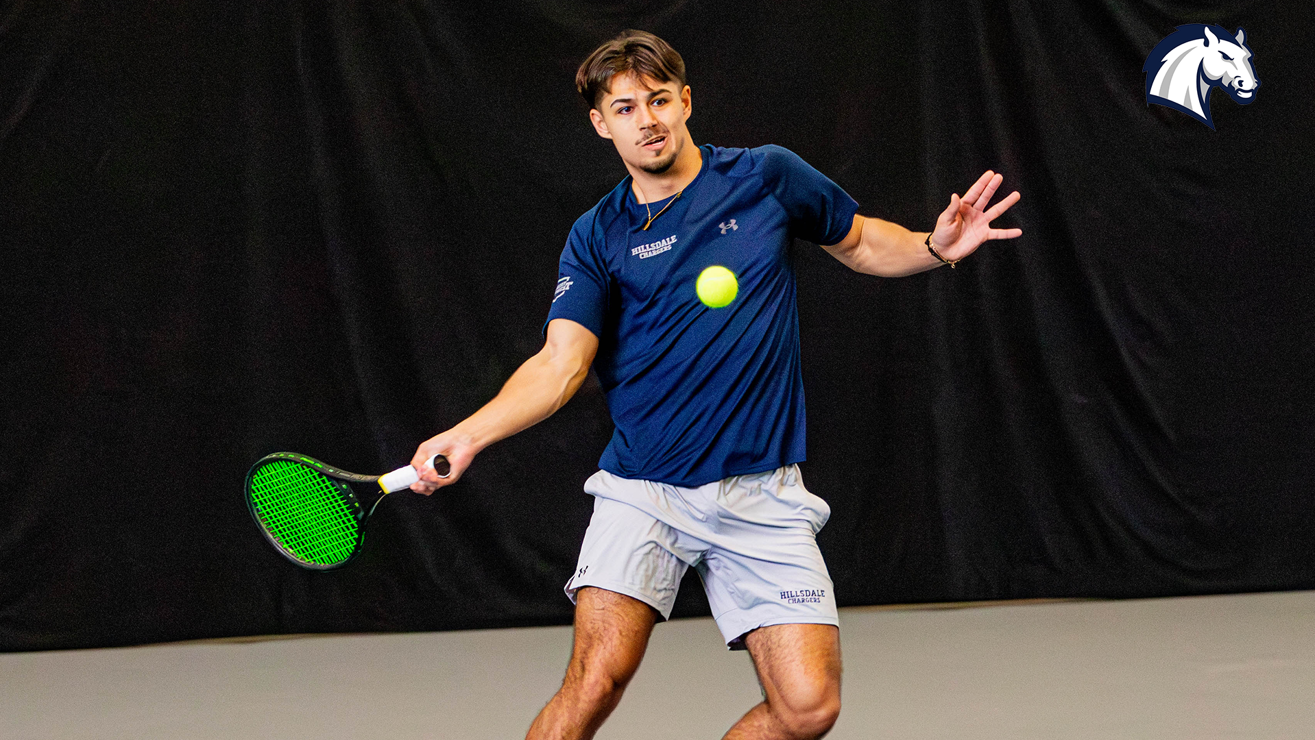 Hillsdale's Ryan Papazov lines up a return shot during a match against Roosevelt on March 8, 2026.