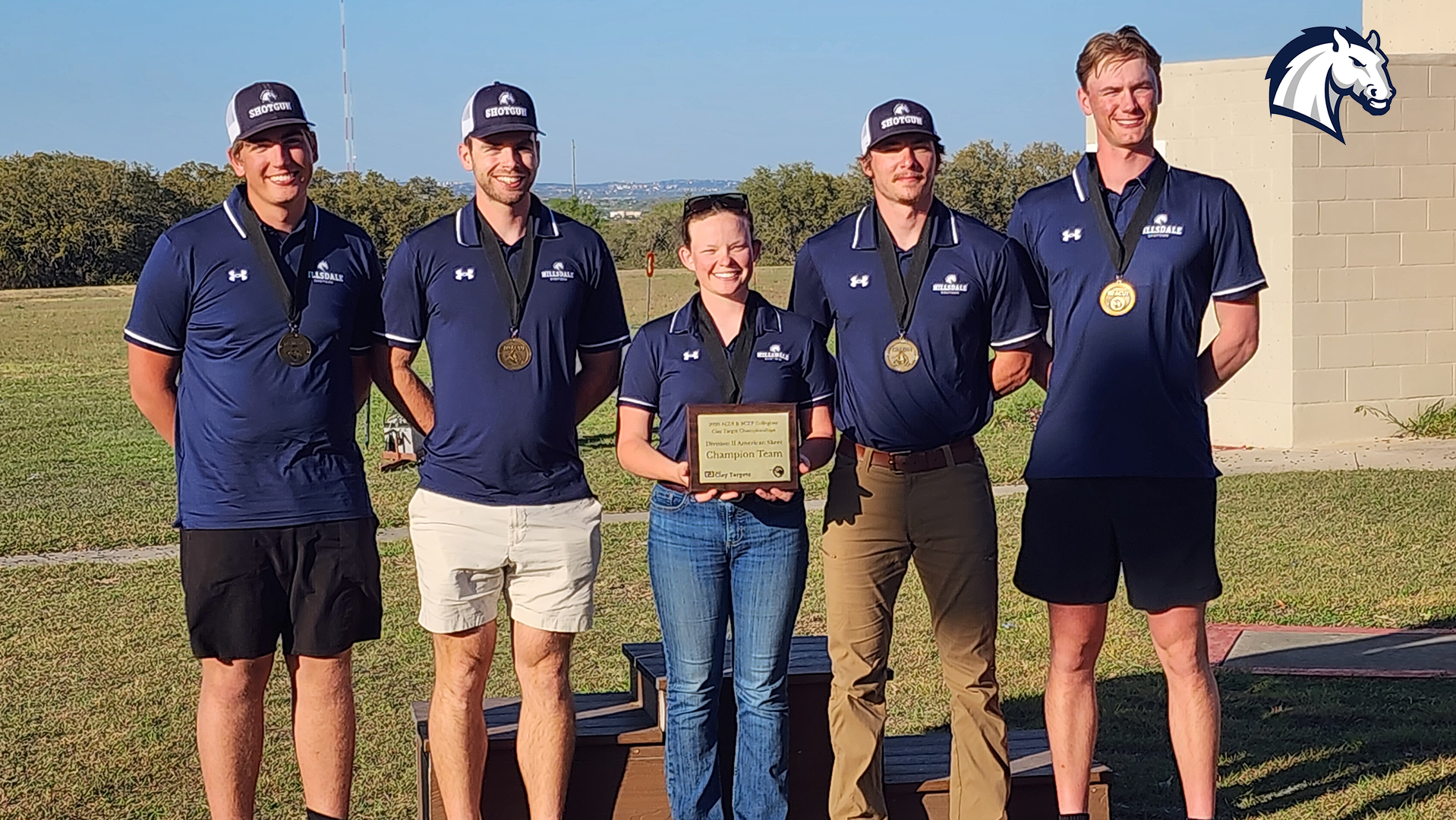 Several Chargers All-Americans pose with their medals and other awards at the 2026 ACUI/SCTP Collegiate Championships in March.