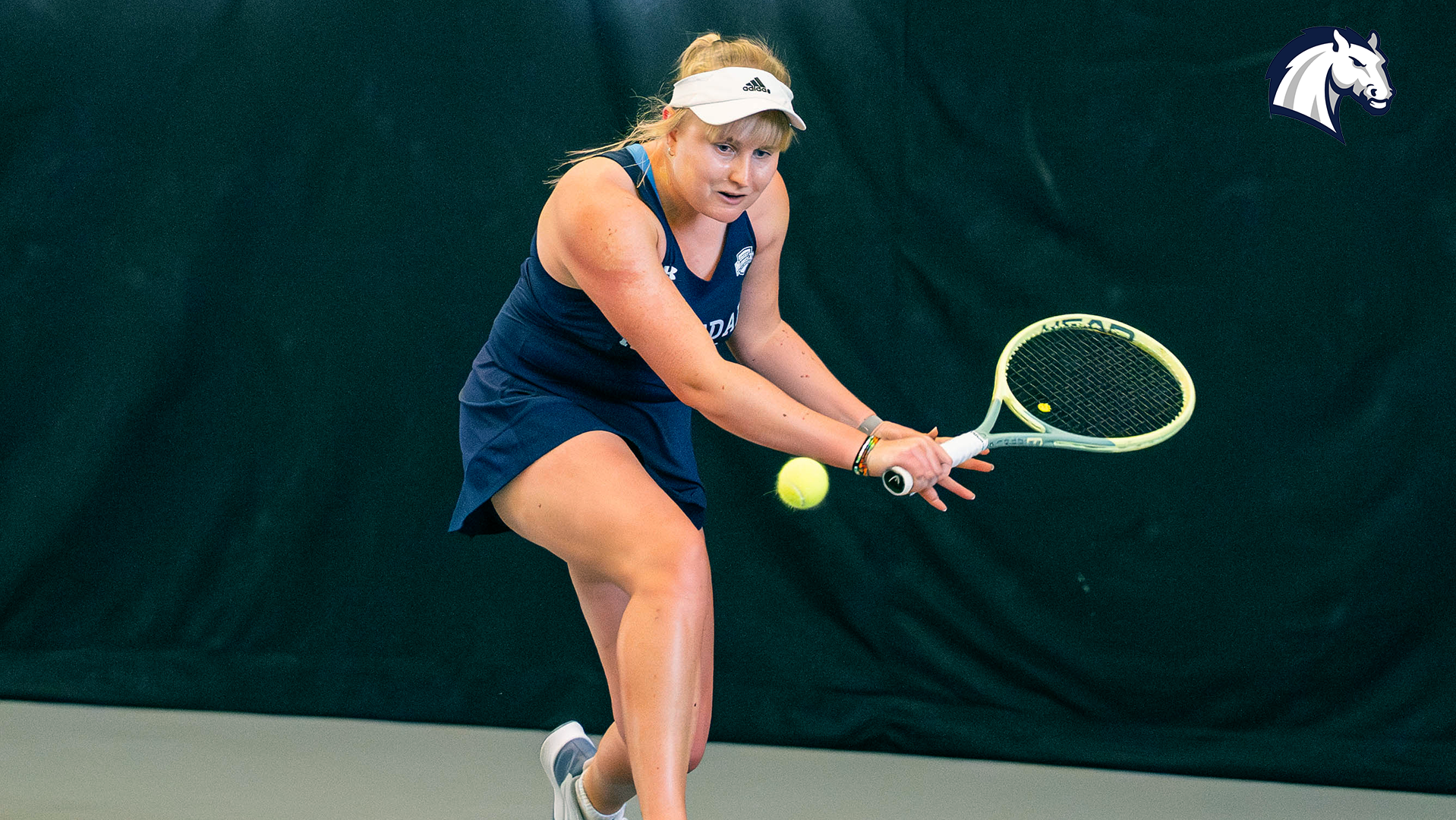 Hillsdale's Ane Dannhauser hits a backhand return in a home match against Findlay on March 27, 2026.