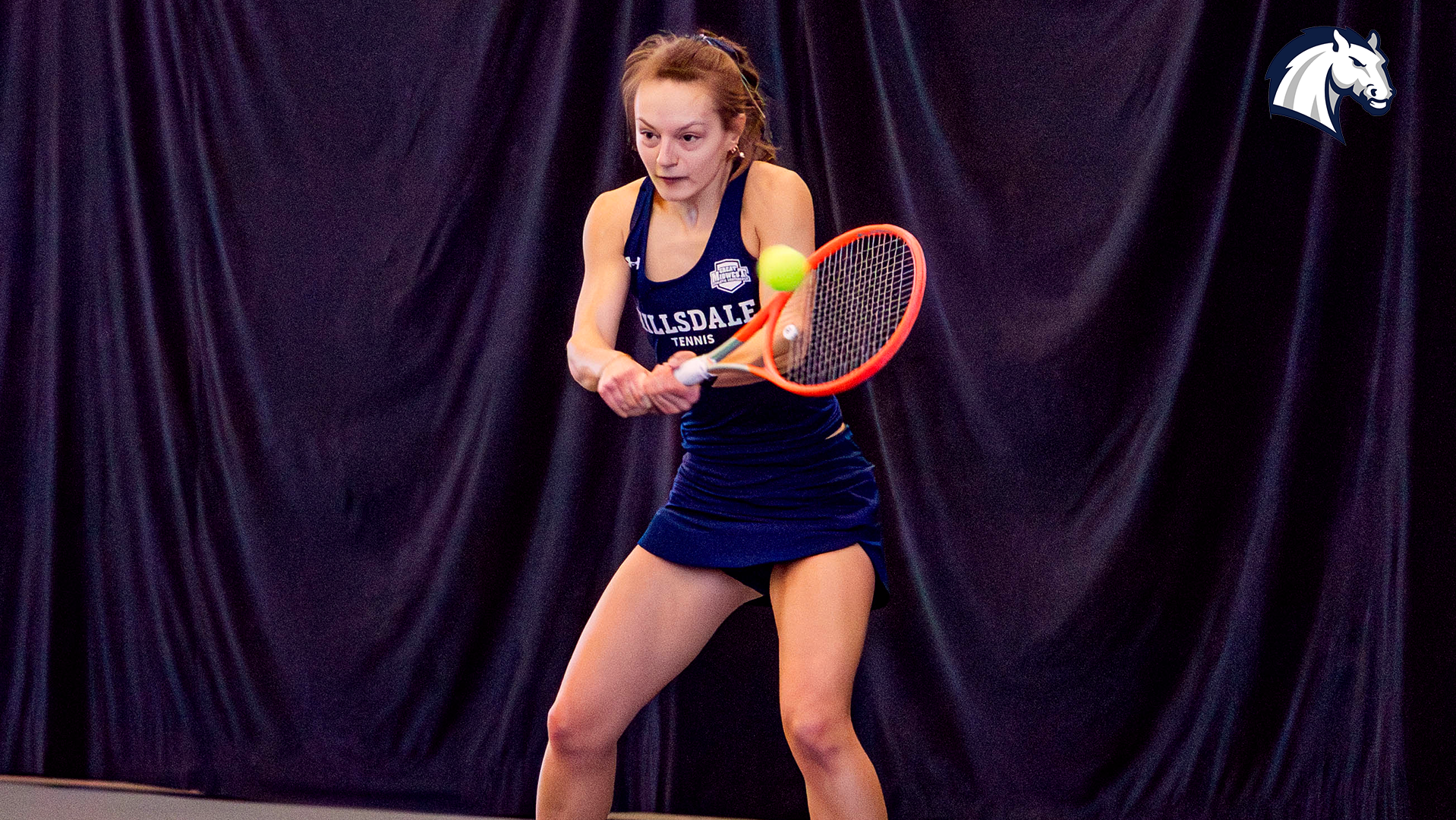 Freshman Esther Sura hits a return shot for Hillsdale College during a match against Roosevelt on March 8, 2026.