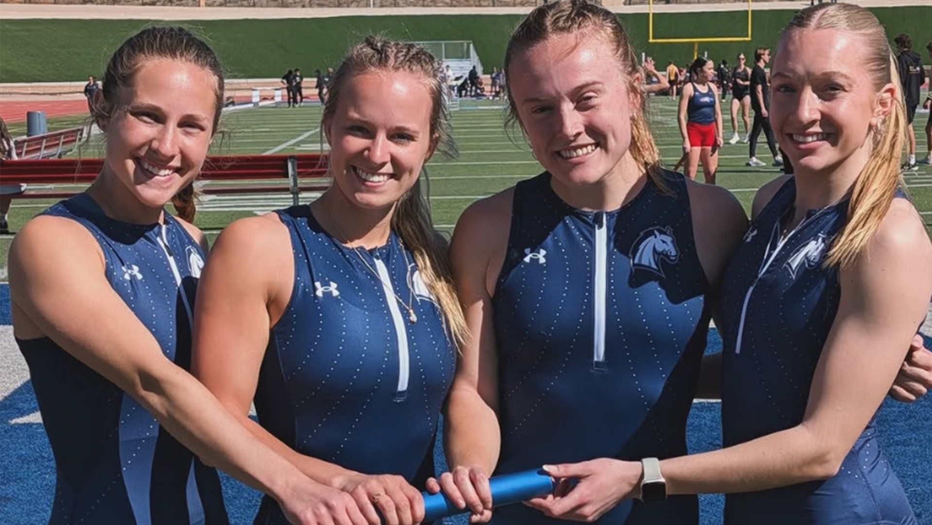 Hillsdale's record-setting 4x100 relay team of (from left) Francesca Federici, Lucy Minning, Anna Lamoreaux and Anna Roessner poses with the baton in Pueblo, Colorado on March 28, 2026.
