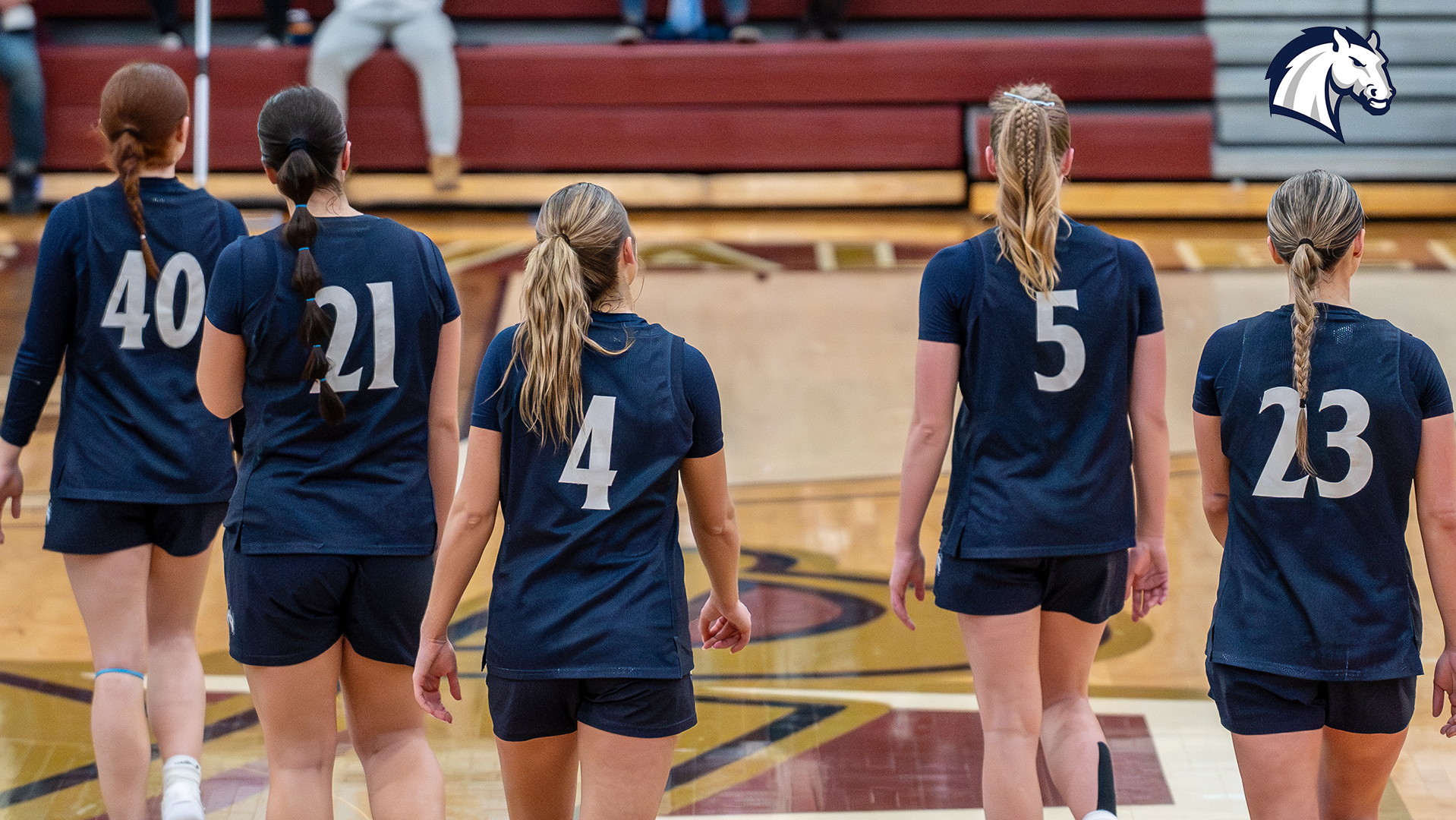 Hillsdale players walking back on court after a timeout.