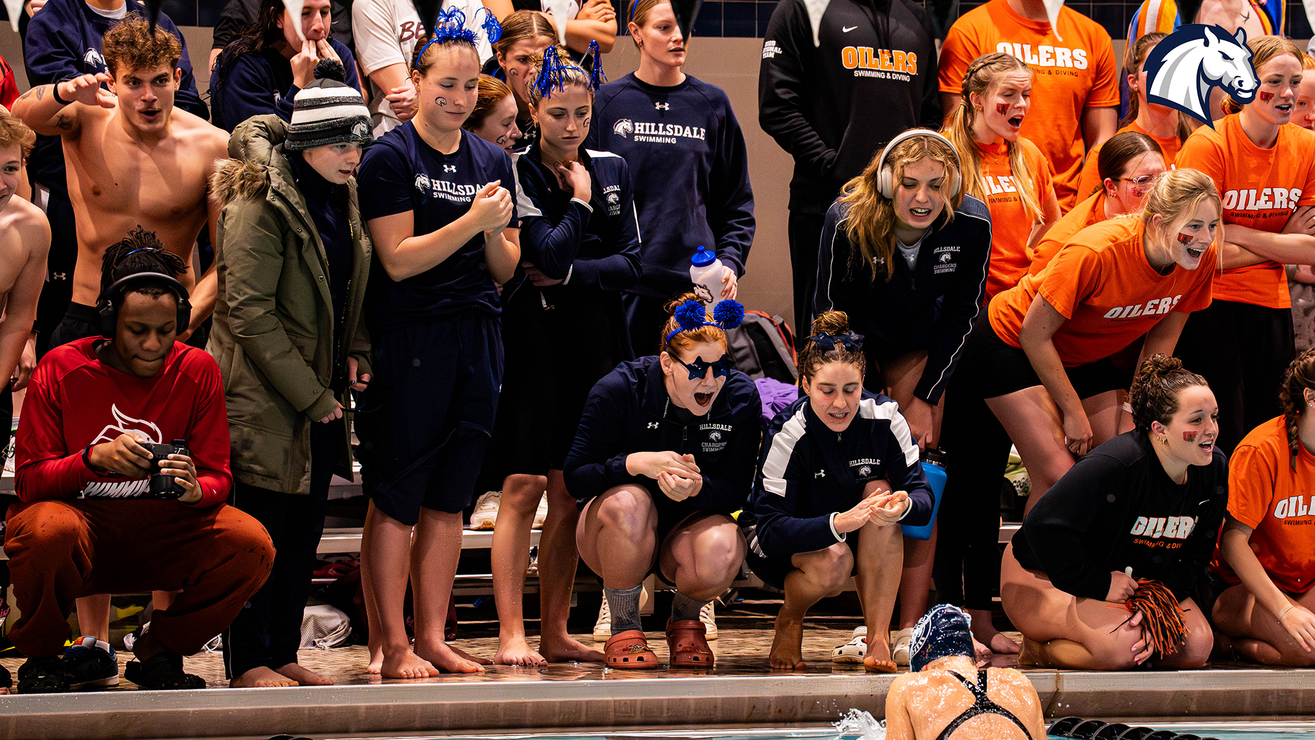 Hillsdale teammates cheer on Lauren Kamp as she competes in the breaststroke at the 2026 G-MAC/MEC Championships.