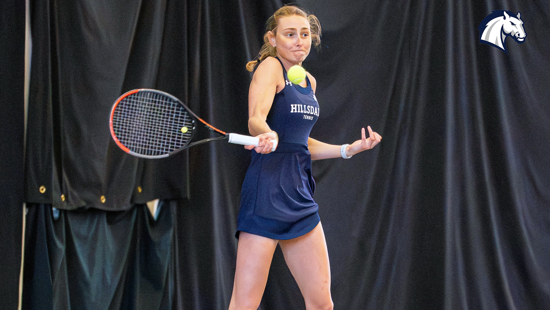 Hillsdale's Megan Hackman hits a return shot against Findlay on March 27, 2026.