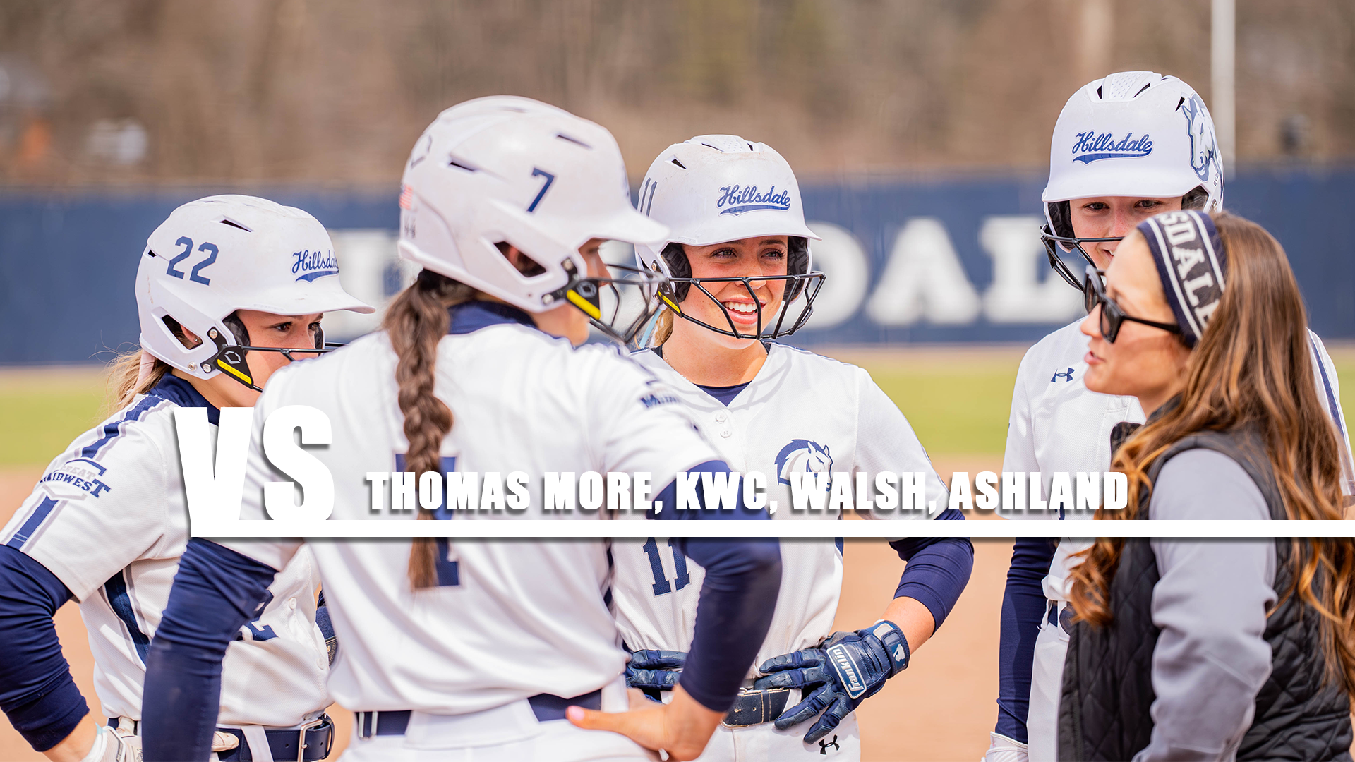 Hillsdale players discuss strategy during a mound meeting in a softball game against Ursuline on March 29, 2026.