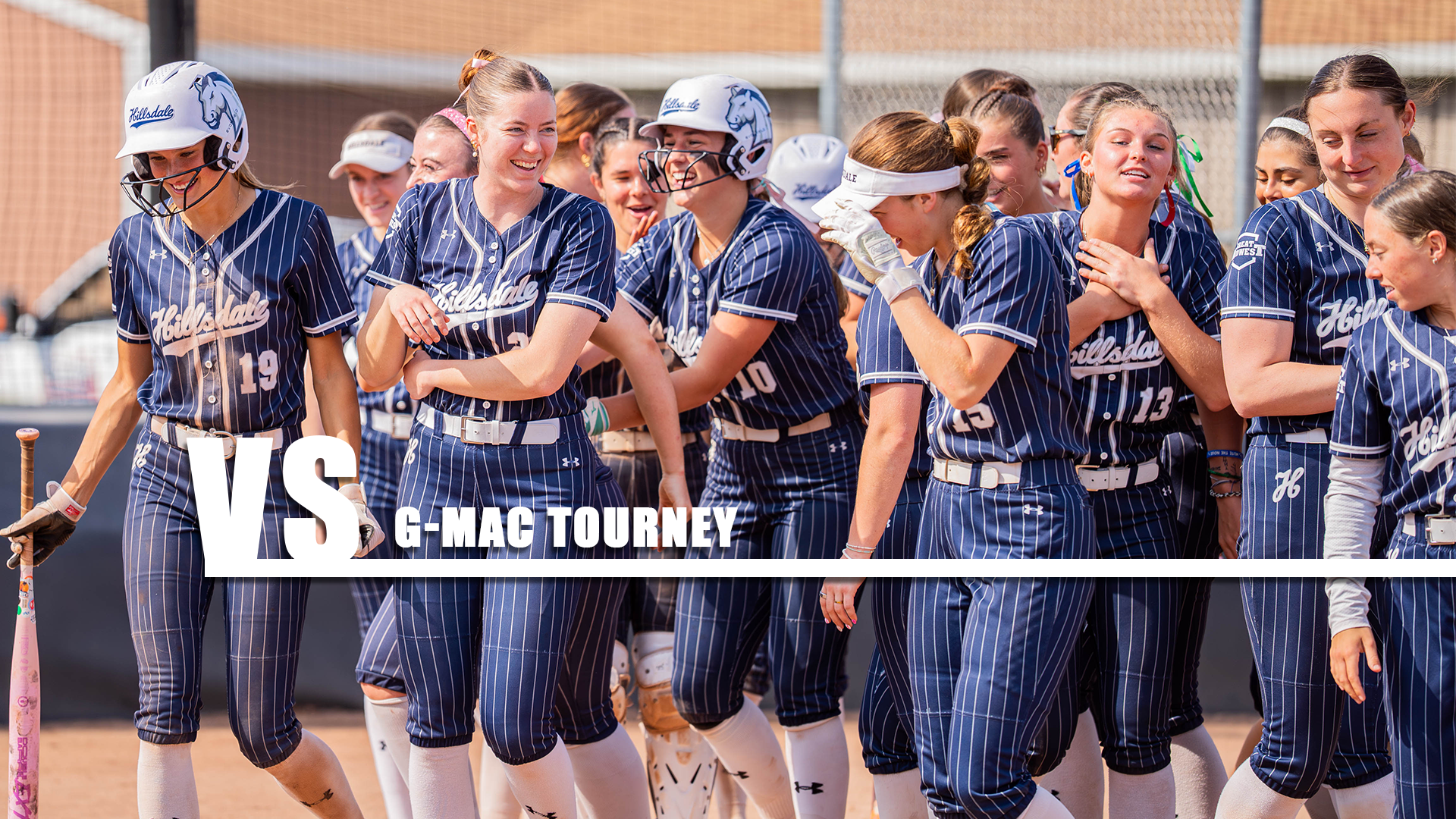 Shot of Hillsdale's softball team celebrating after a home run against Cedarville on March 30, 2026.