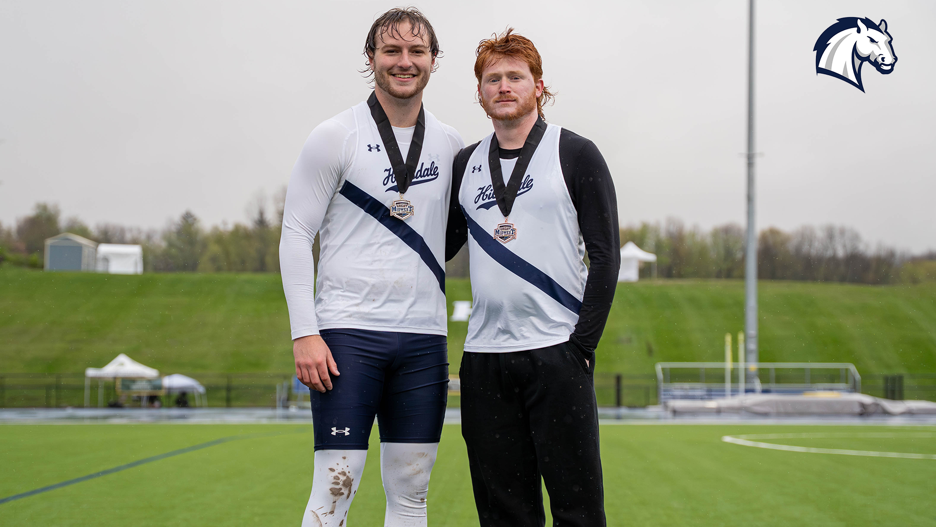 Chargers Tommy Flud (left) and Ethan Dorrell pose for a photo after top three finishes in the javelin at the 2026 G-MAC Outdoor Championships.