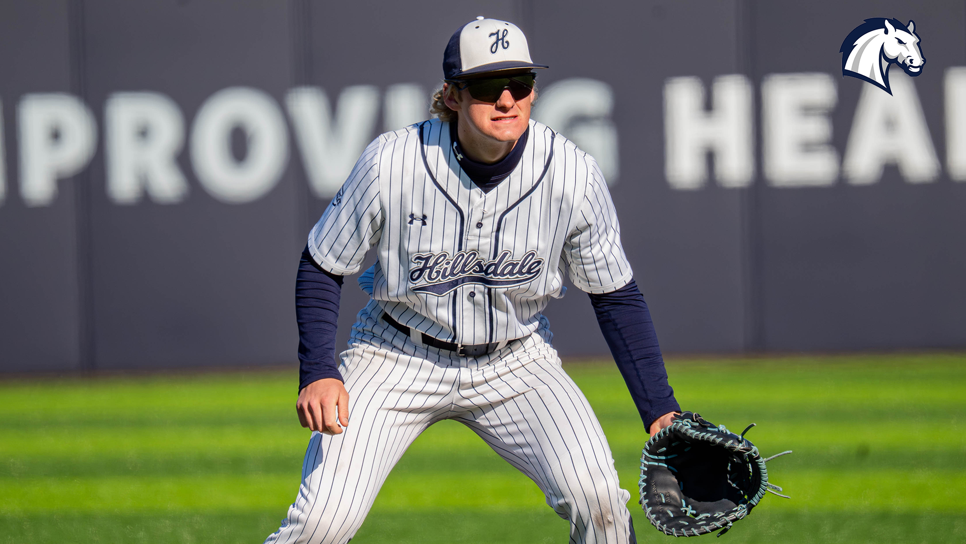 Hillsdale's Nolan Coppens stands in the ready position at first base.