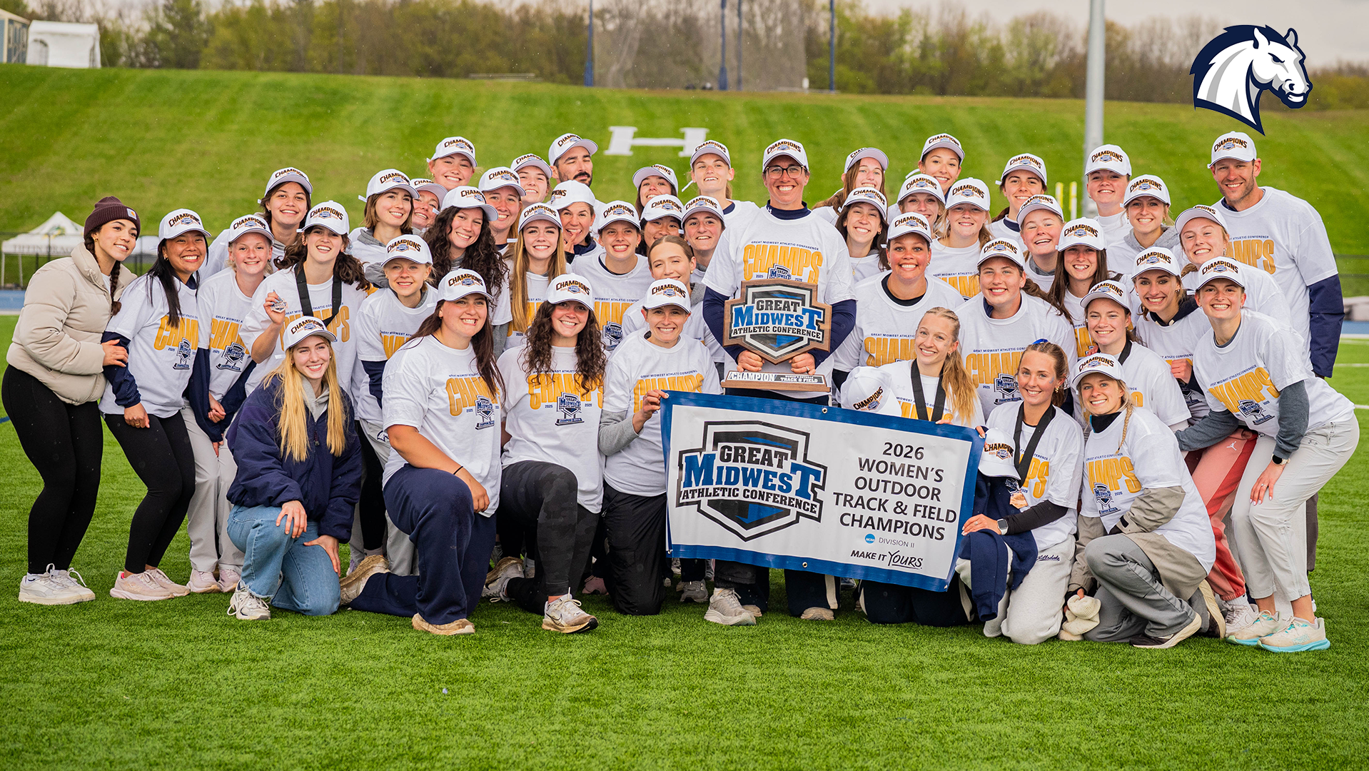 Hillsdale's women's track and field team poses with the trophy after winning the 2026 G-MAC Outdoor Championships on May 1, 2026.