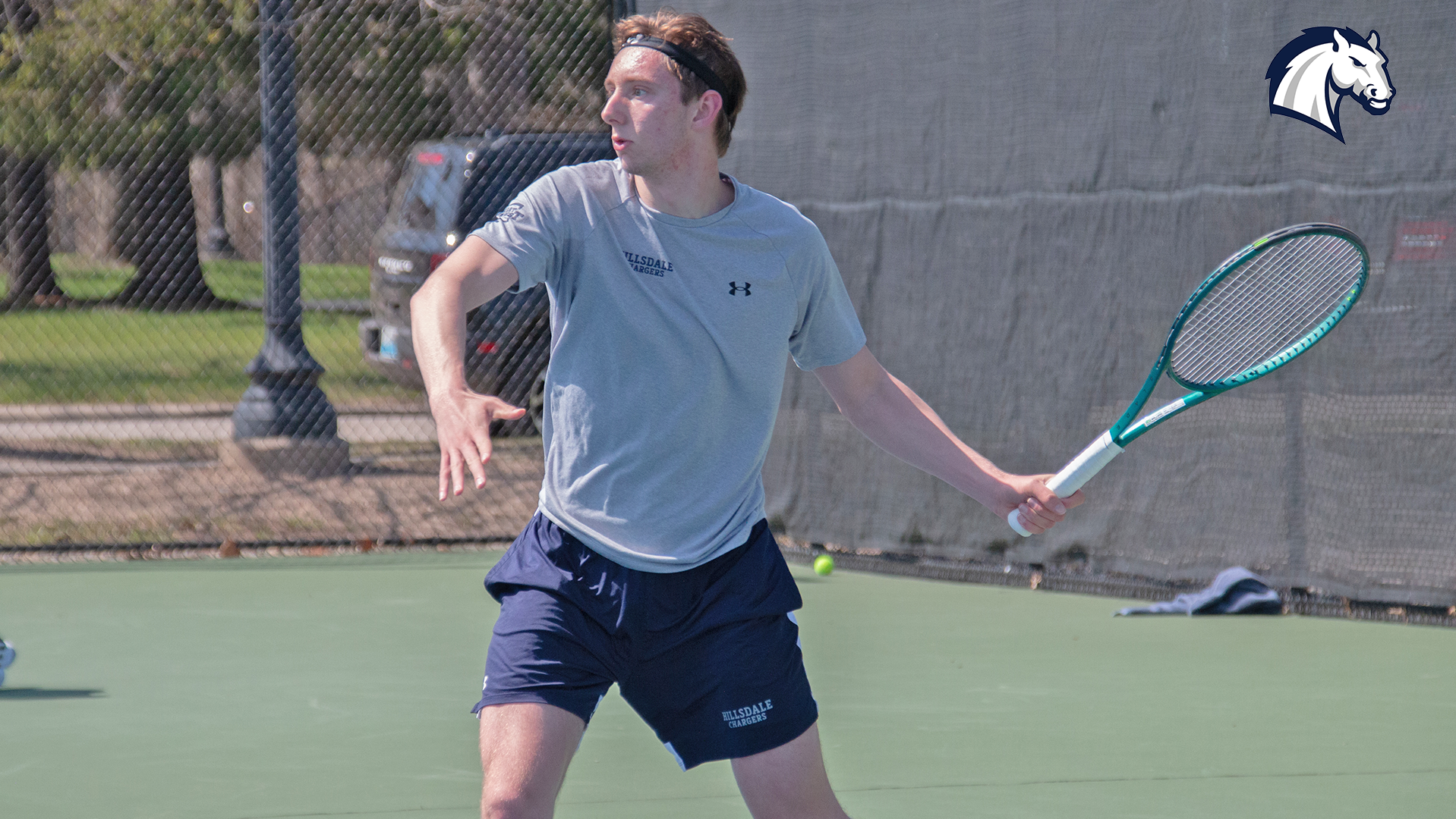 Hillsdale's Sam Plys lines up a return against Thomas More in April 2026.