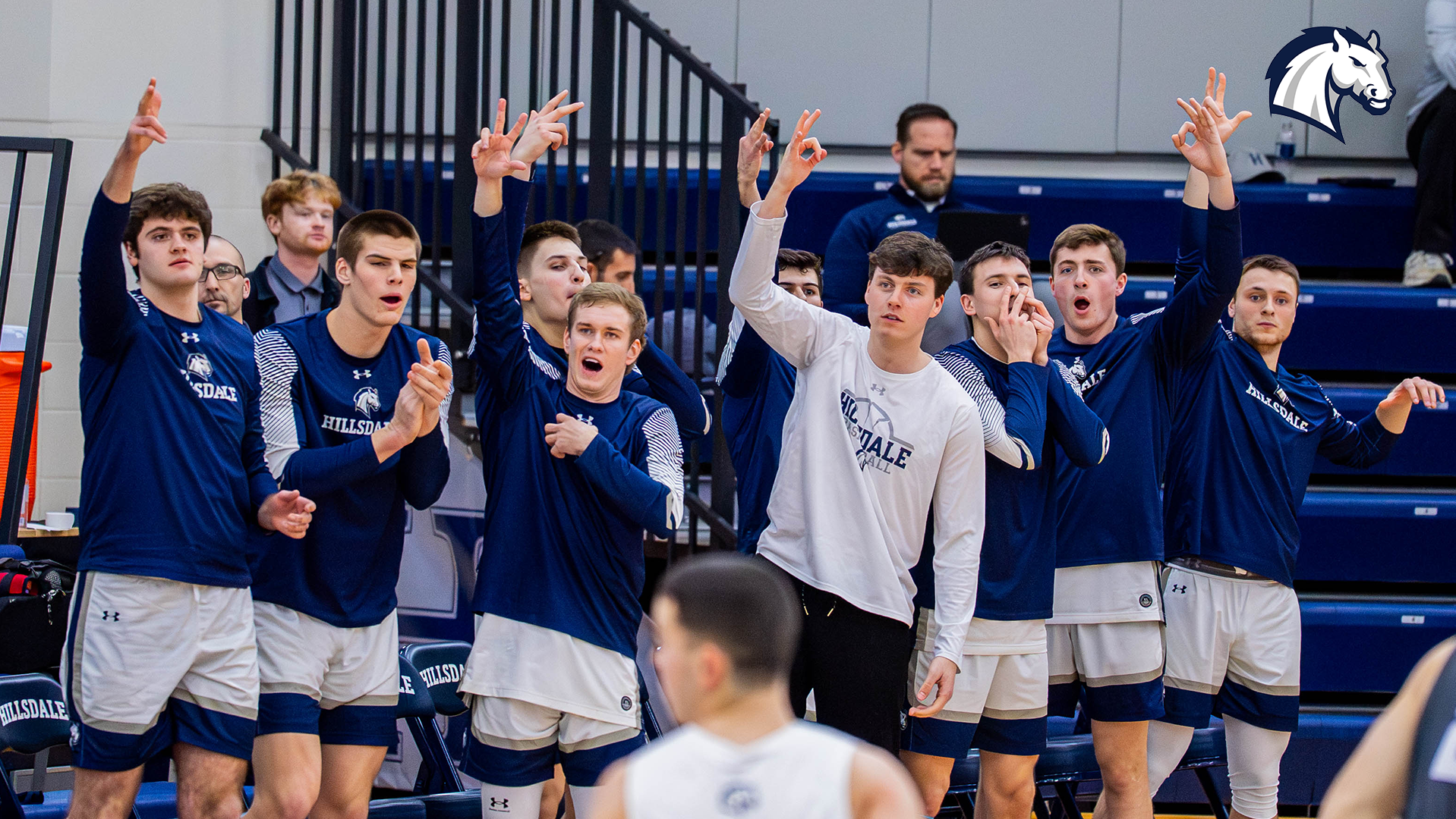 Chargers bench celebrates after a made 3-pointer during the 2025-26 season.