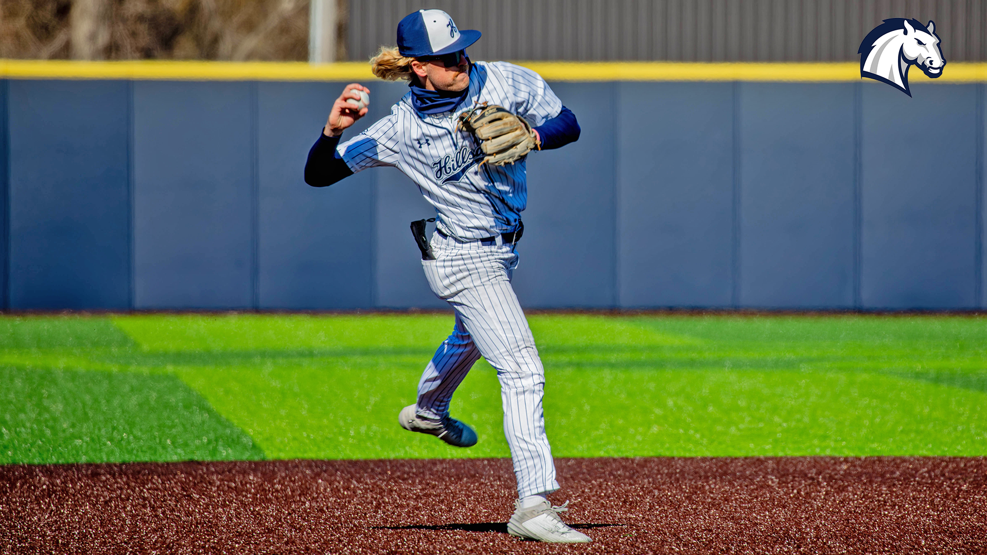 Hillsdale shortstop Aaron Jasiak winds up a throw to get an out at first in a game against Ohio Dominican in March 2026.