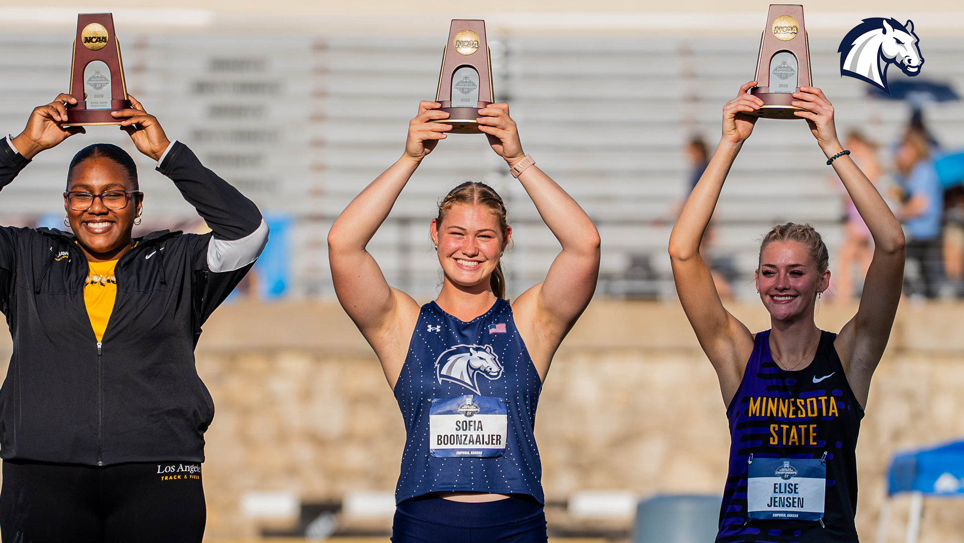 Hillsdale's Sofia Boonzaaijer holds up her All-American trophy after finishing sixth in the discus at the 2026 NCAA DII Outdoor Championships in Emporia, Kansas.