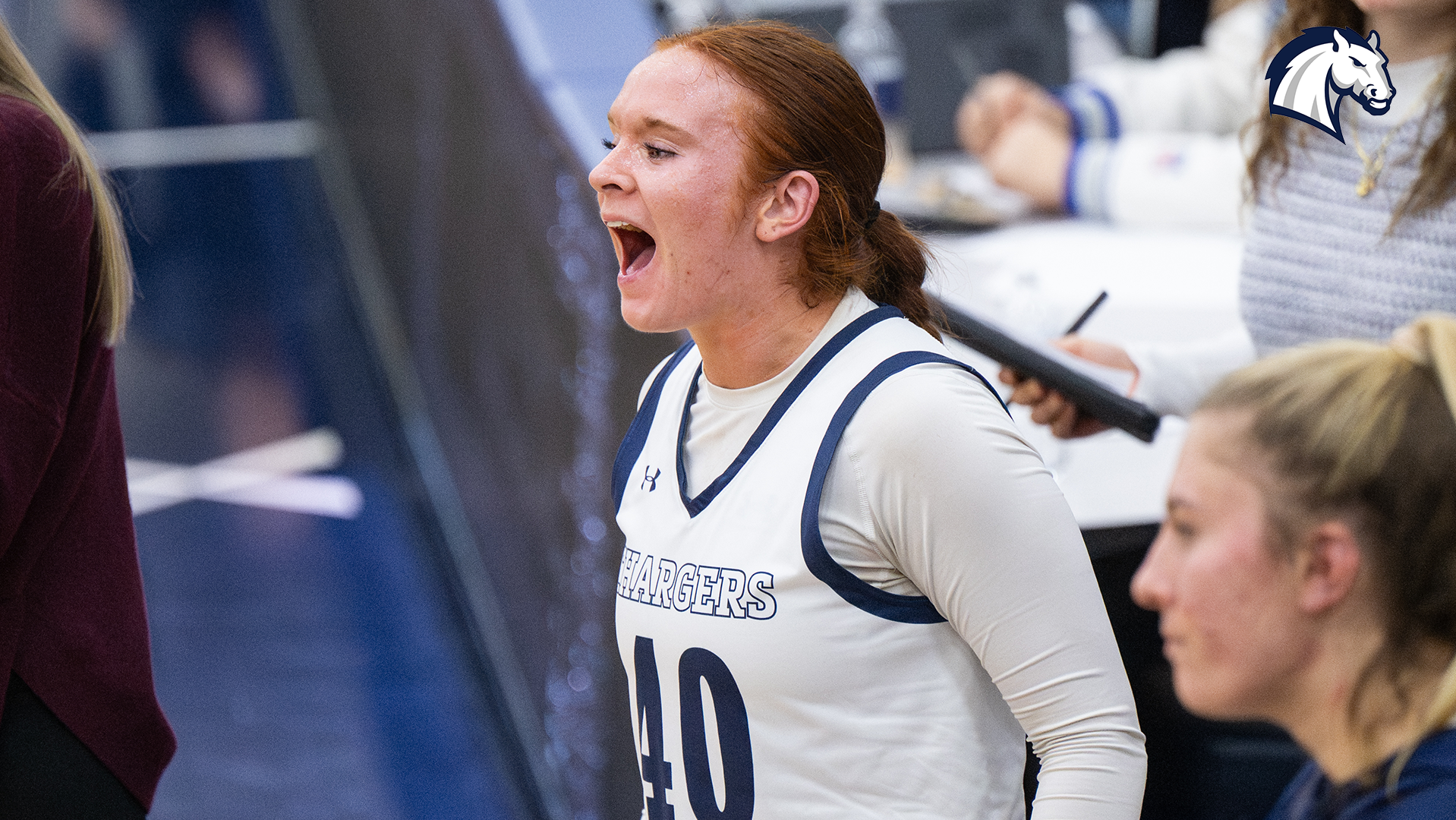 Emma Ruhlman celebrates on the bench after a basket during the 2026 season.