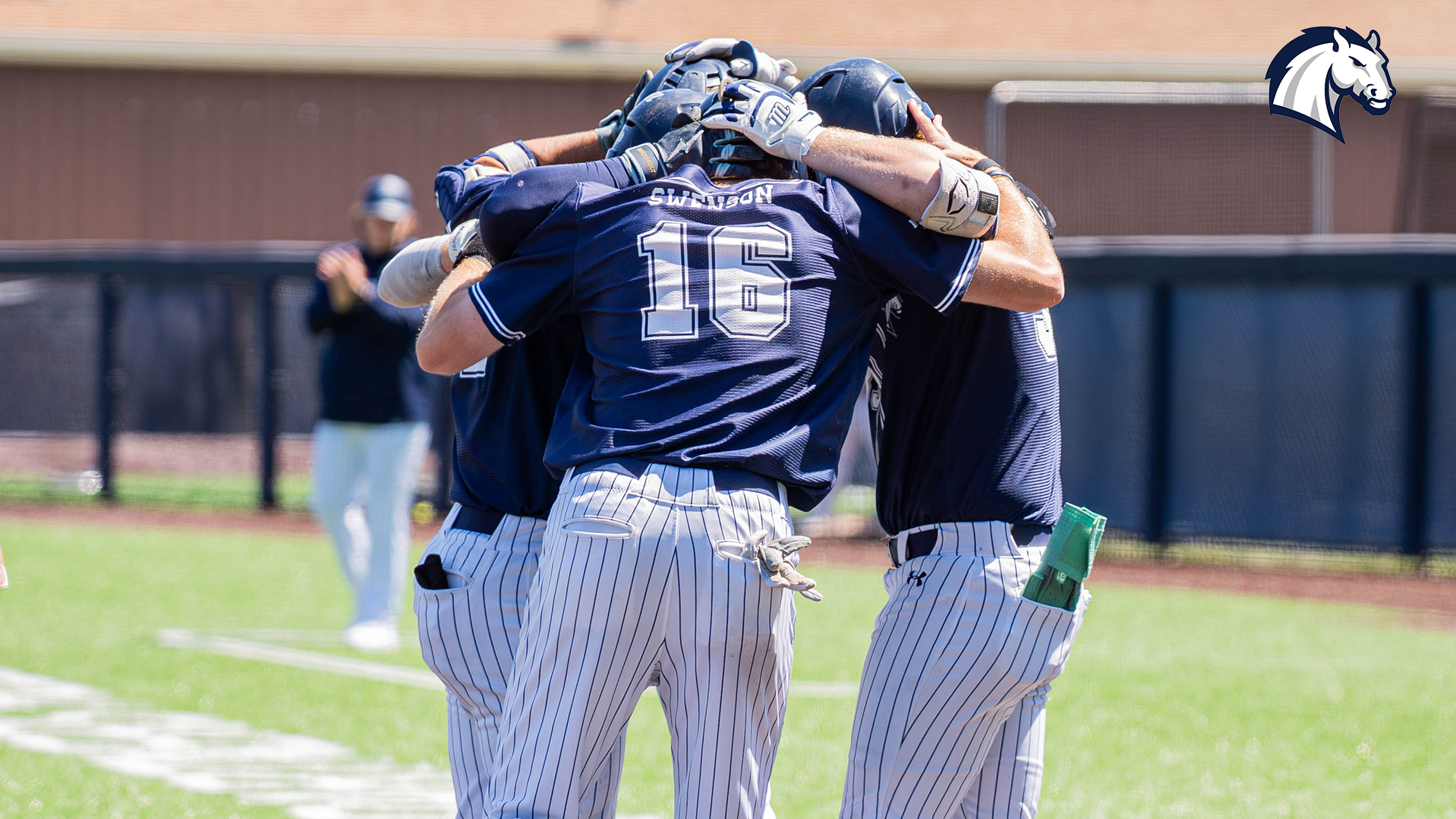 Charger players celebrate at home plate after a three-run home run against Tiffin during the 2026 season.