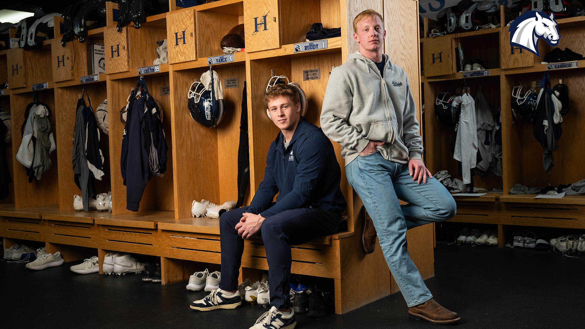 Jacob Vance (left) and Shea Ruddy pose for a photo in the Hillsdale College football locker room.