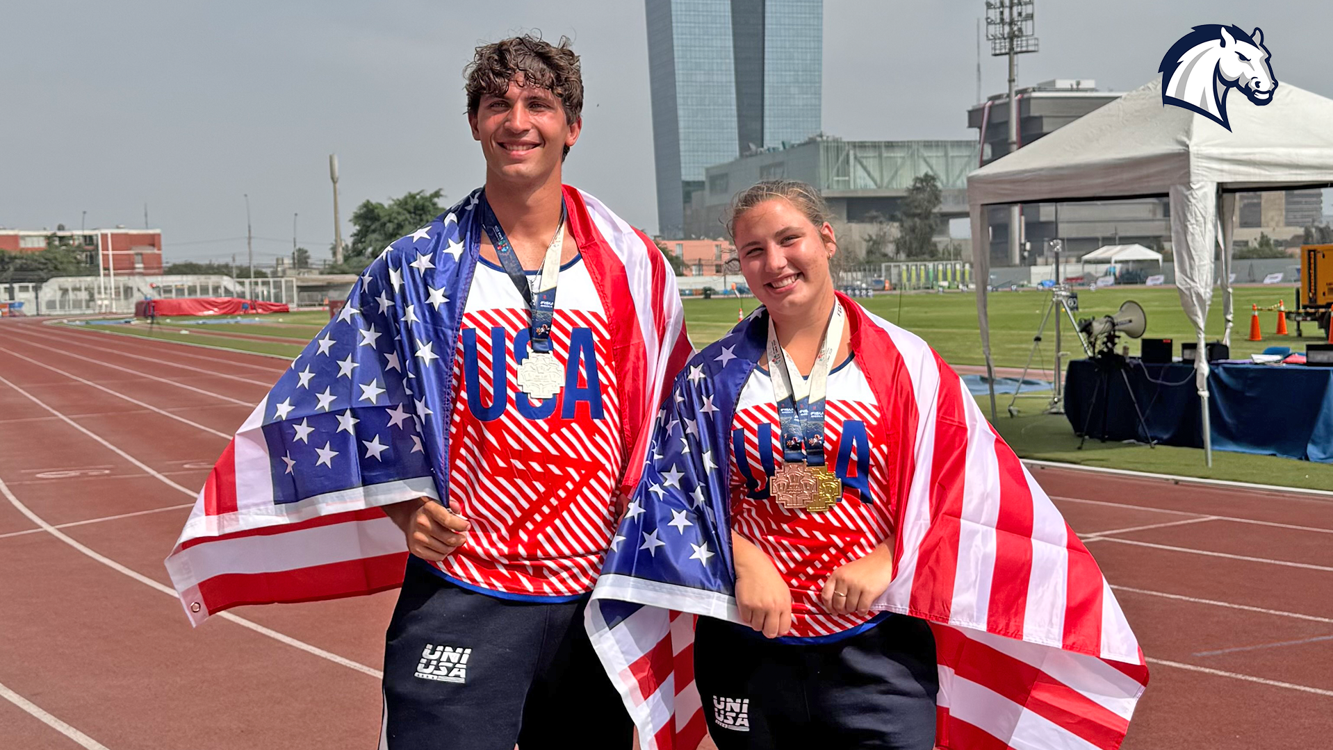 Hillsdale College athletes Dominic Scharer (left) and Amelia Lutz pose with medals won at the 2026 FISU America Games while competing for Team USA.
