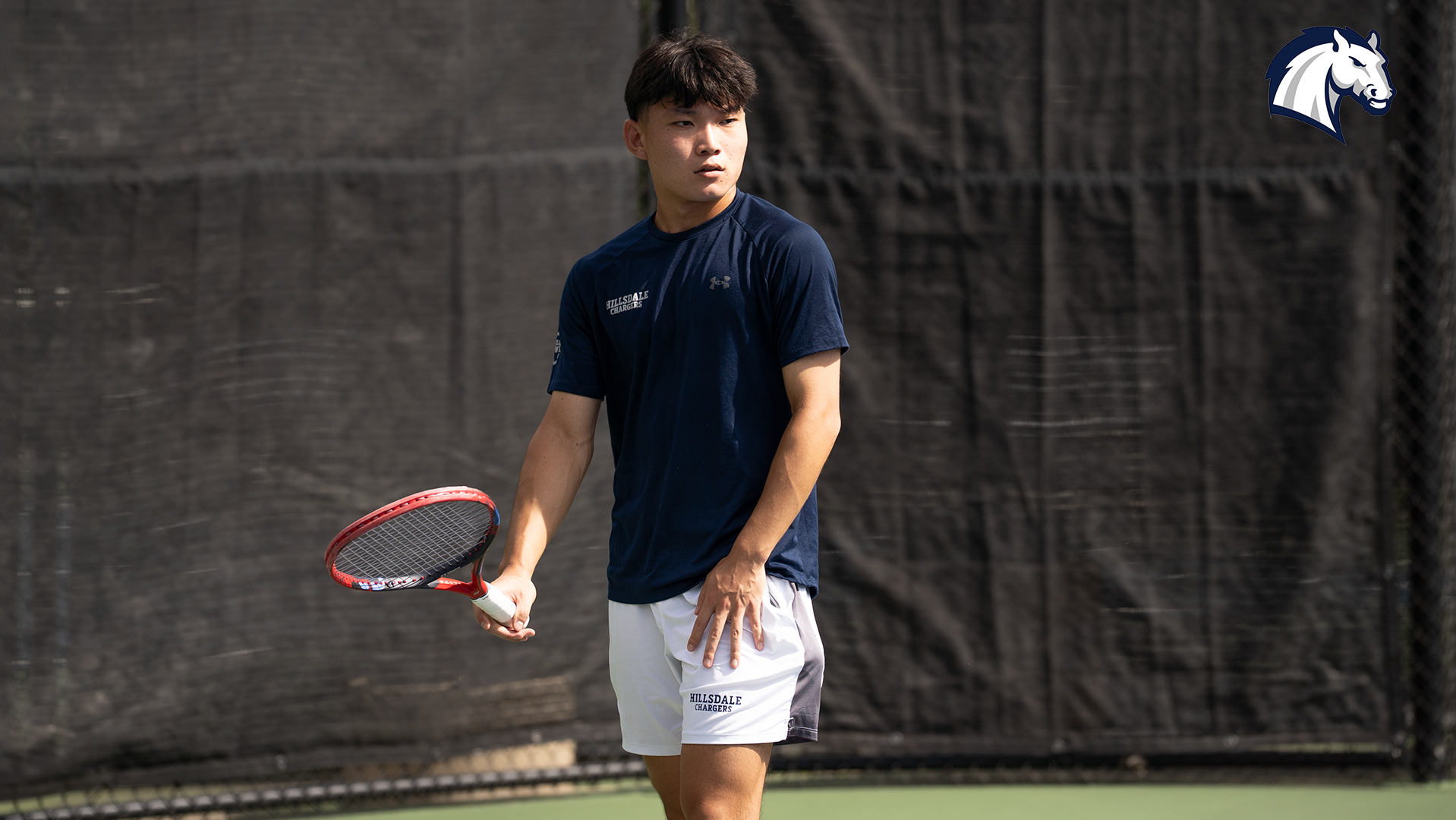 Hillsdale's Rintaro Goda prepares to serve during the Chargers' 2026 home summer invitational on Sept. 13.