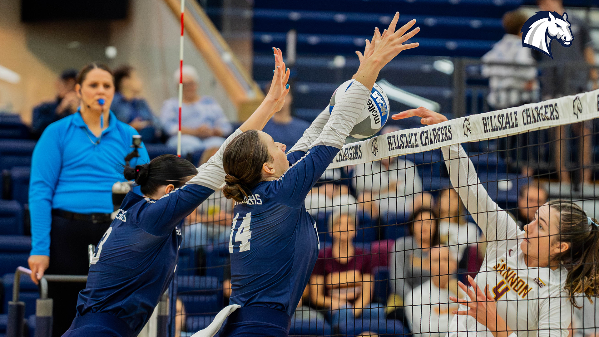 Hillsdale's Molly Kennedy (3) and Grace Drake (14) reject a Gannon kill attempt during a match on Sept. 18, 2026.